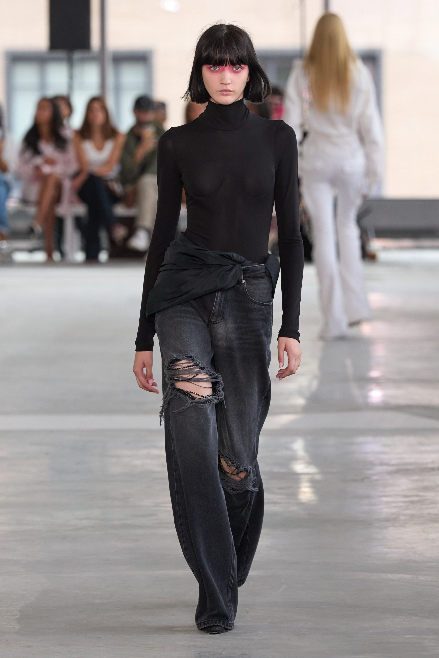 black fitted top and distressed pants