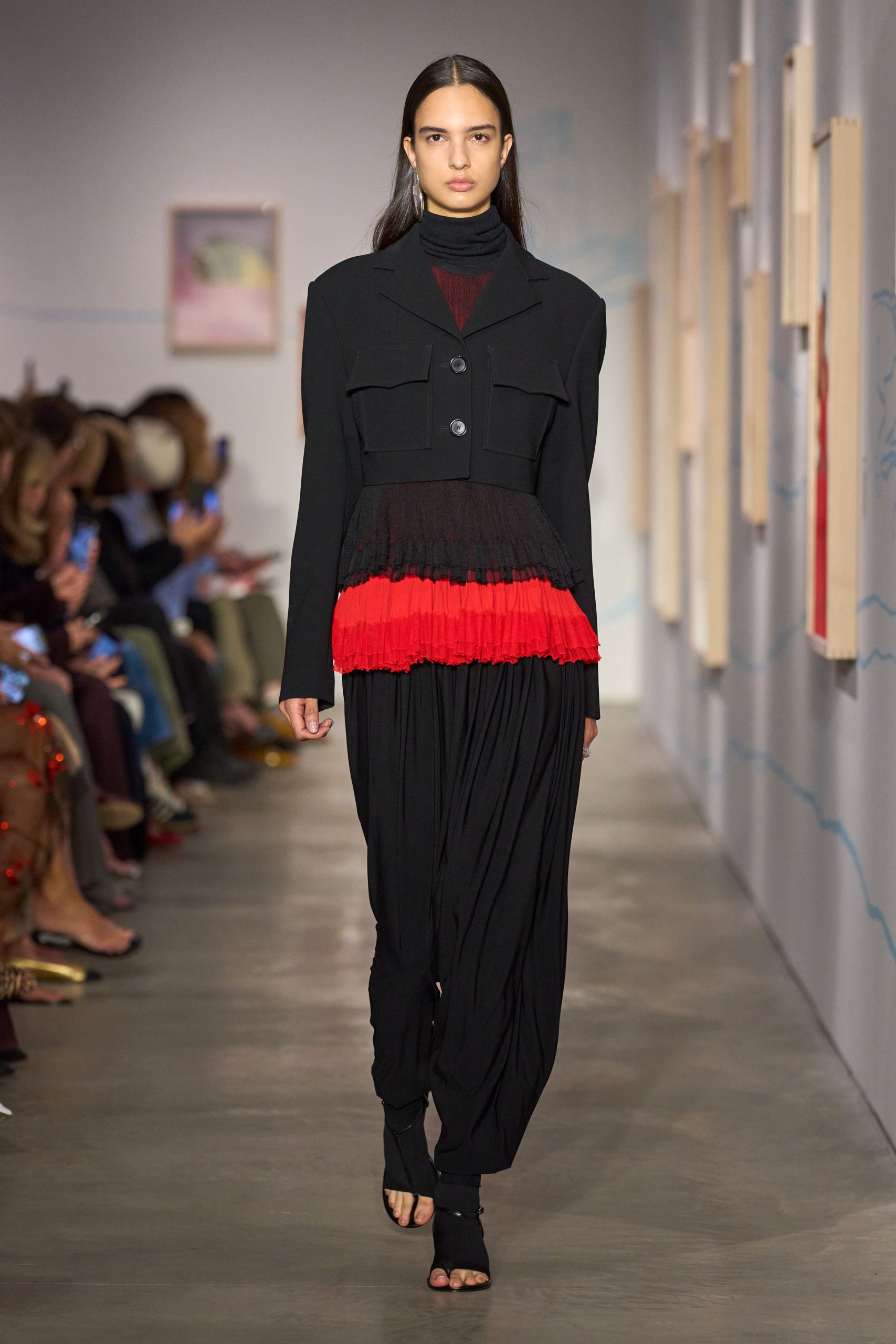 black jacket red pleated dress
