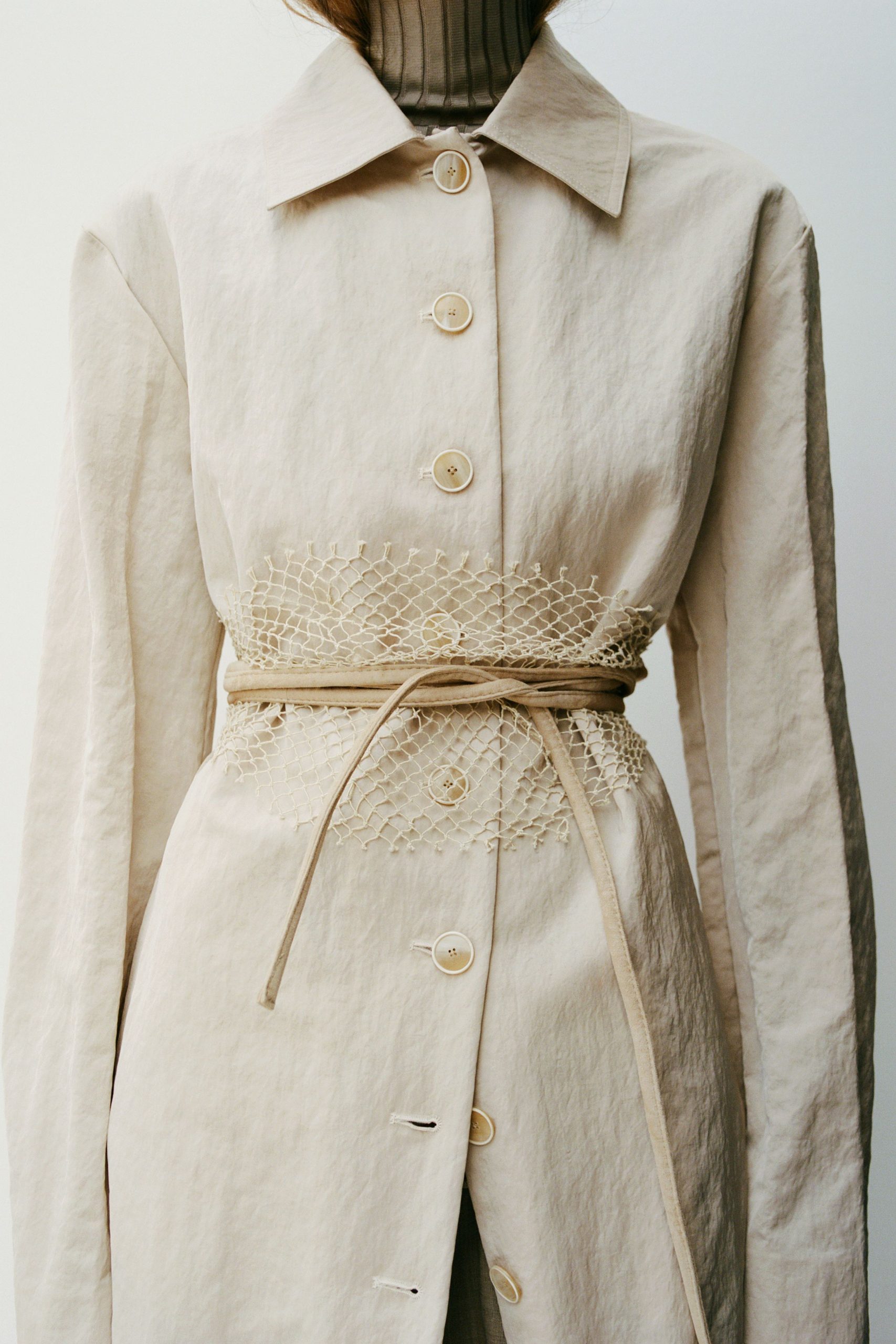 beige fitted coat with belt
