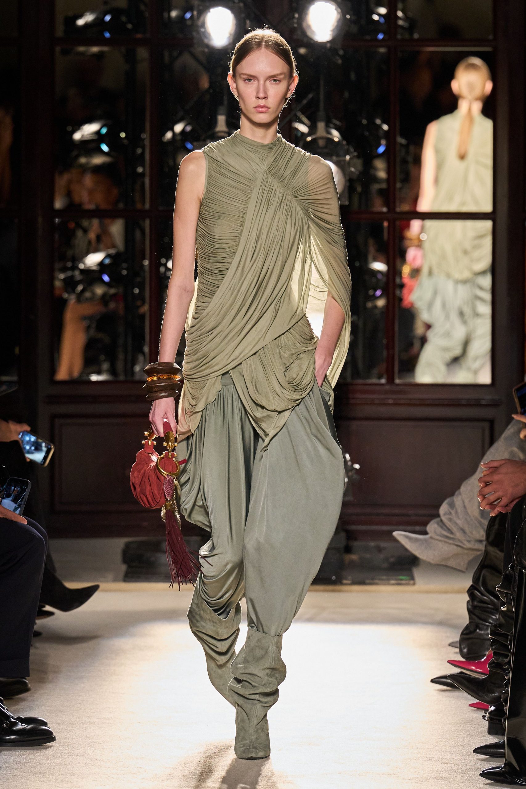 green silk sleeveless high-neck fitted draped layered gown