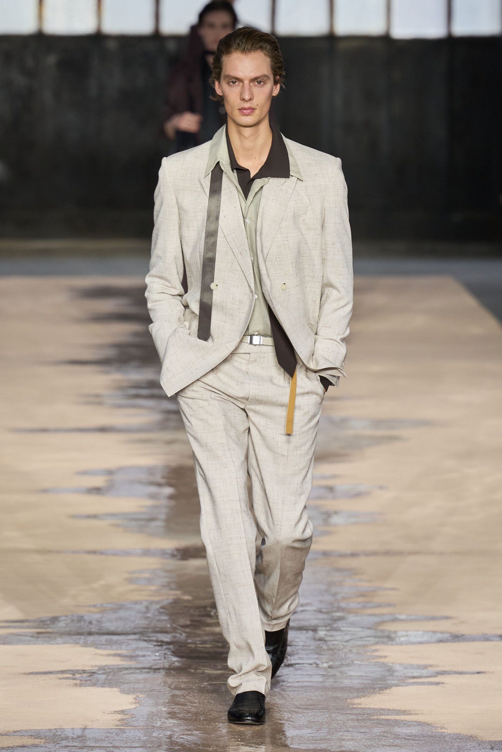 beige tailored suit with black shirt