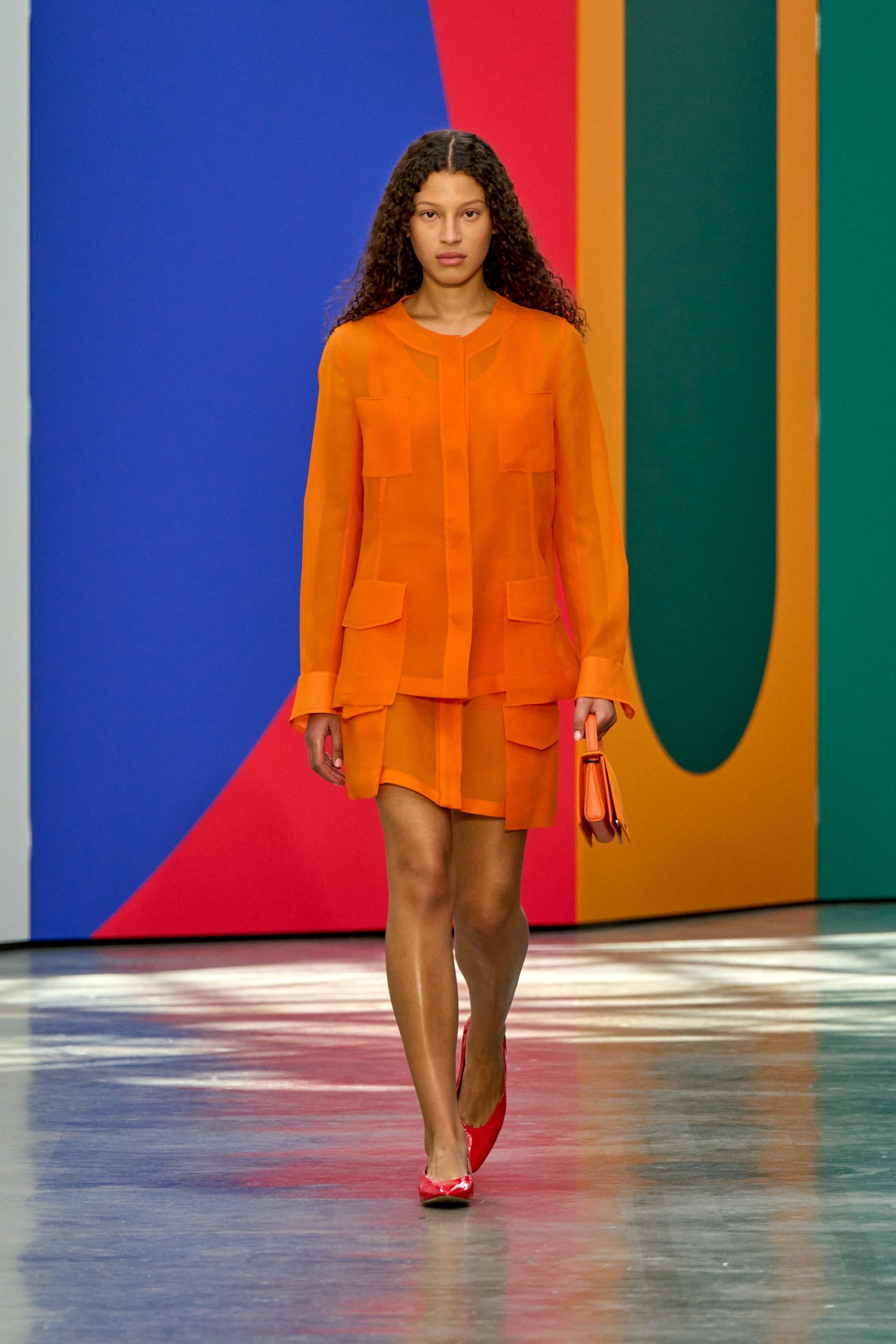 orange silk blouse and mini skirt