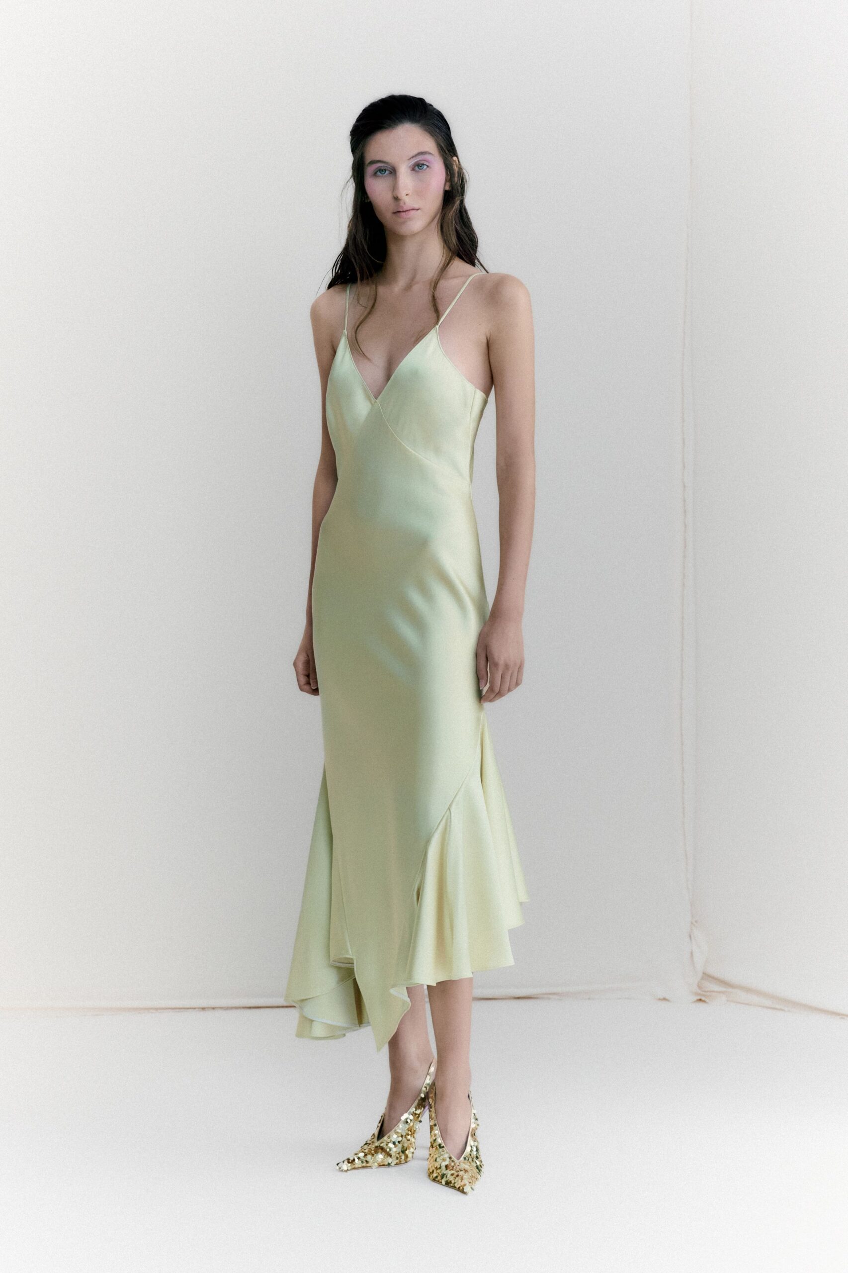 green silk sleeveless v-neck fitted flared flowing dress