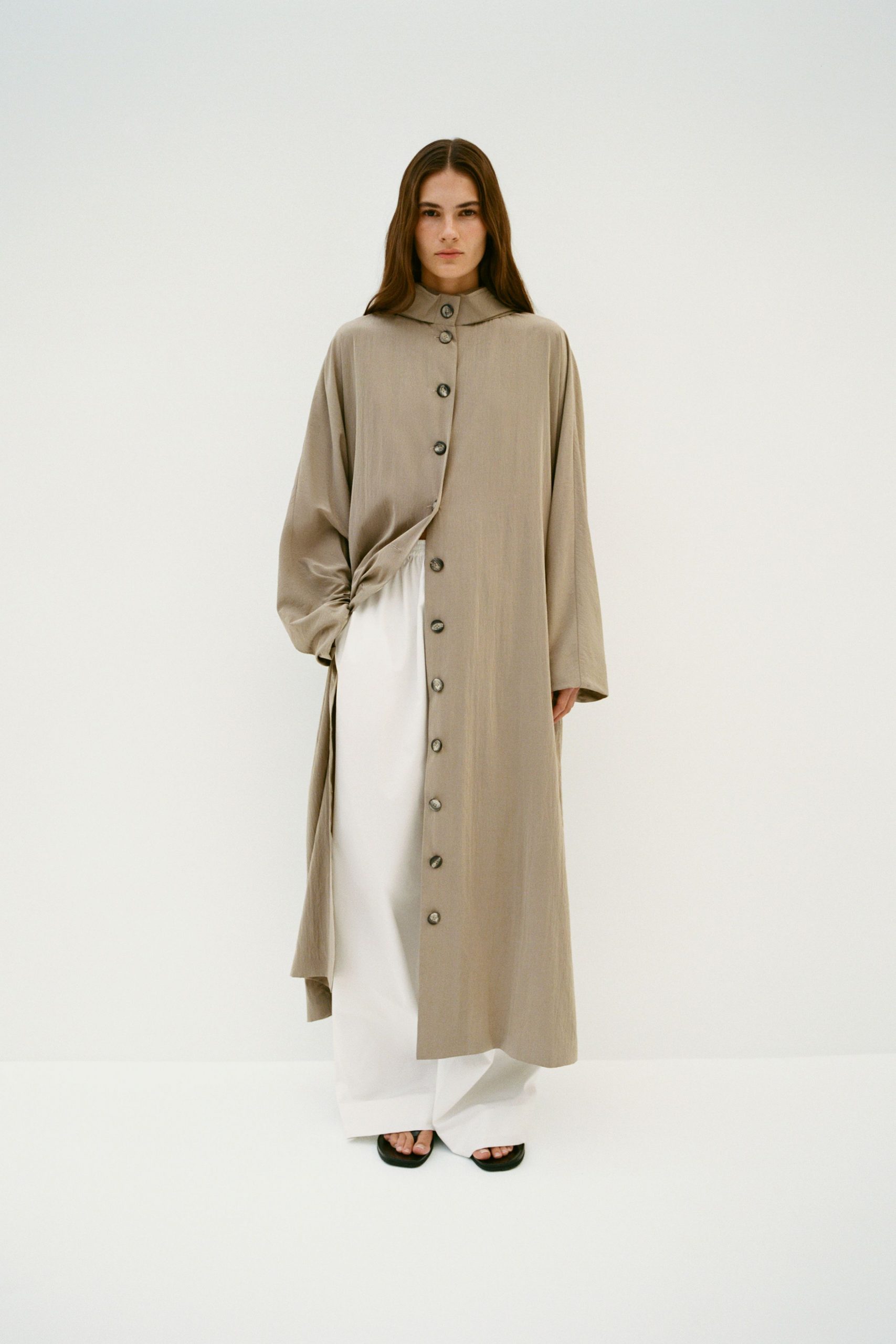 beige coat with white pants