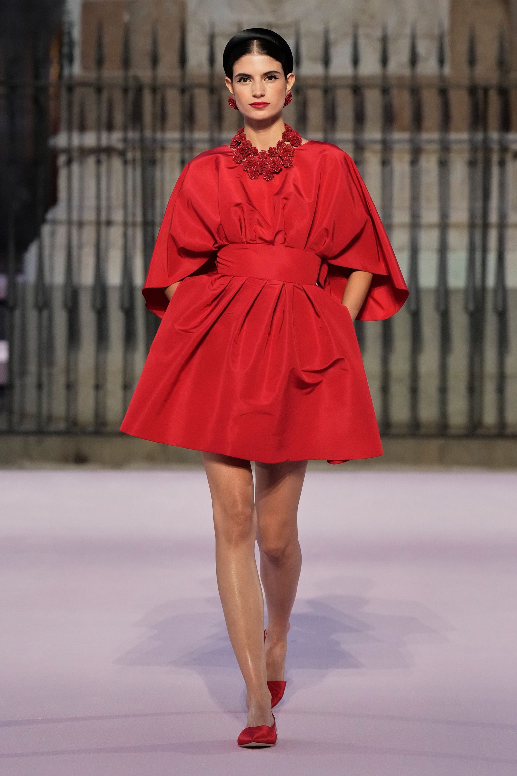 red silk sleeveless collared fitted pleated belted dress