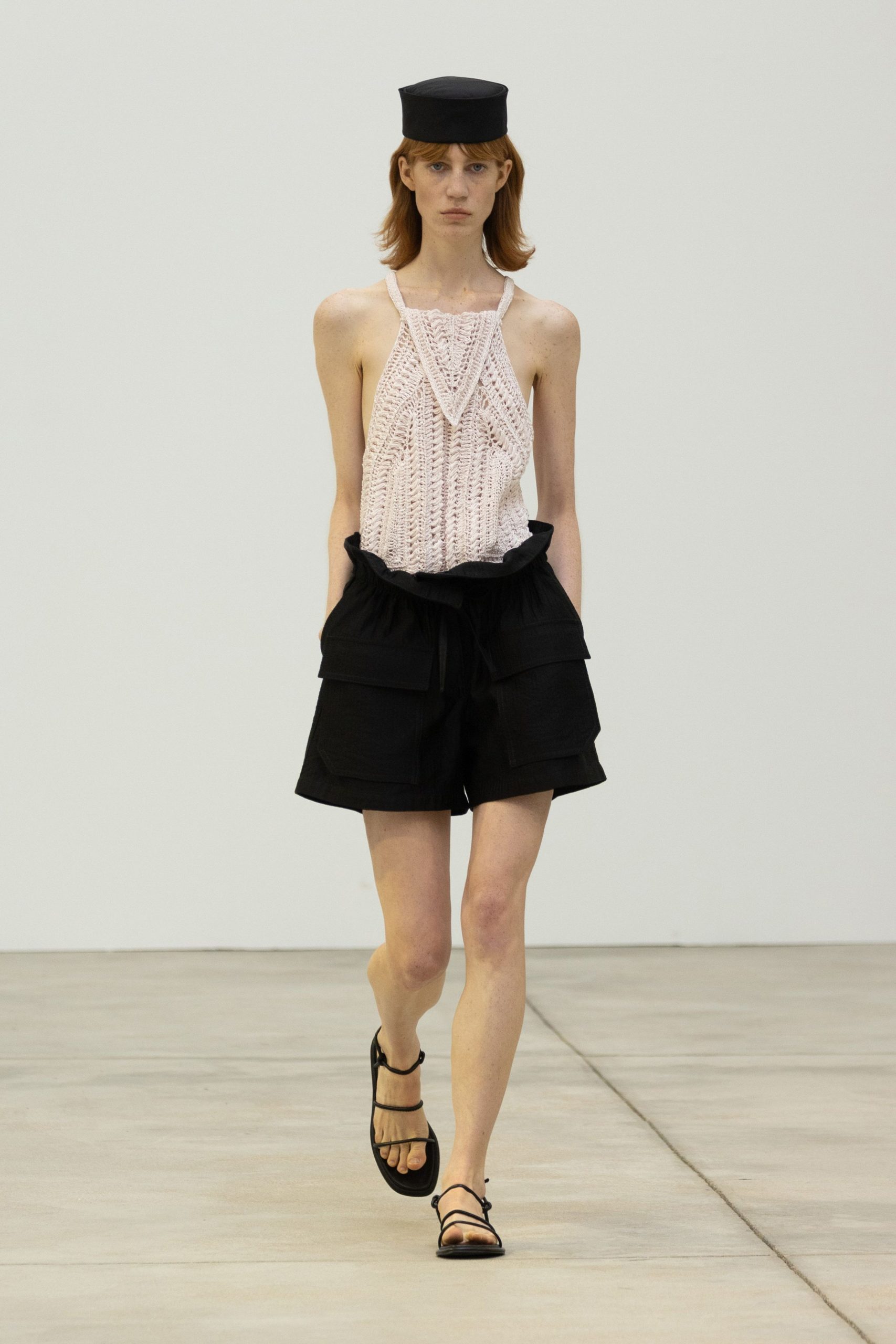 pink crochet top with black shorts