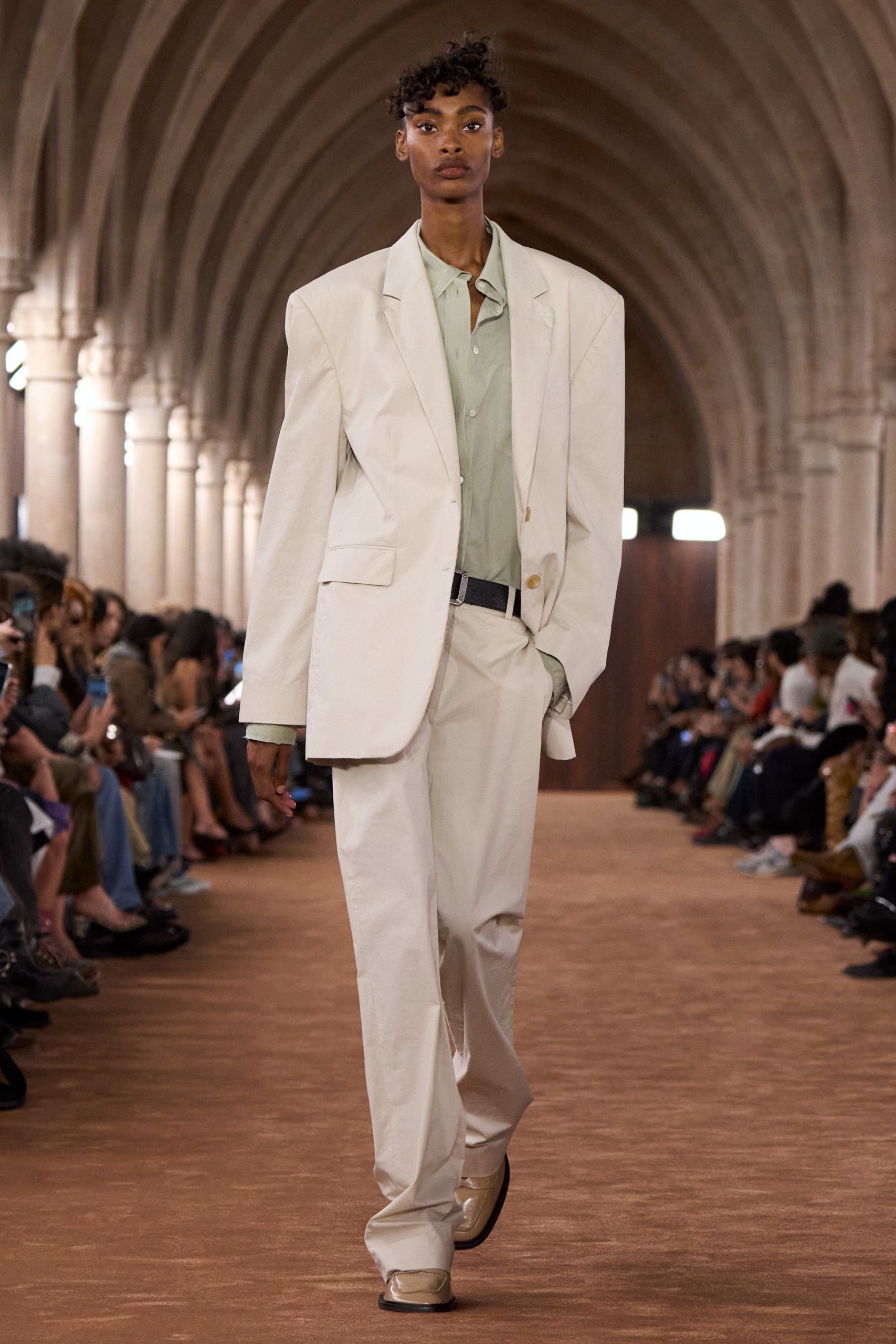 white relaxed suit with green shirt