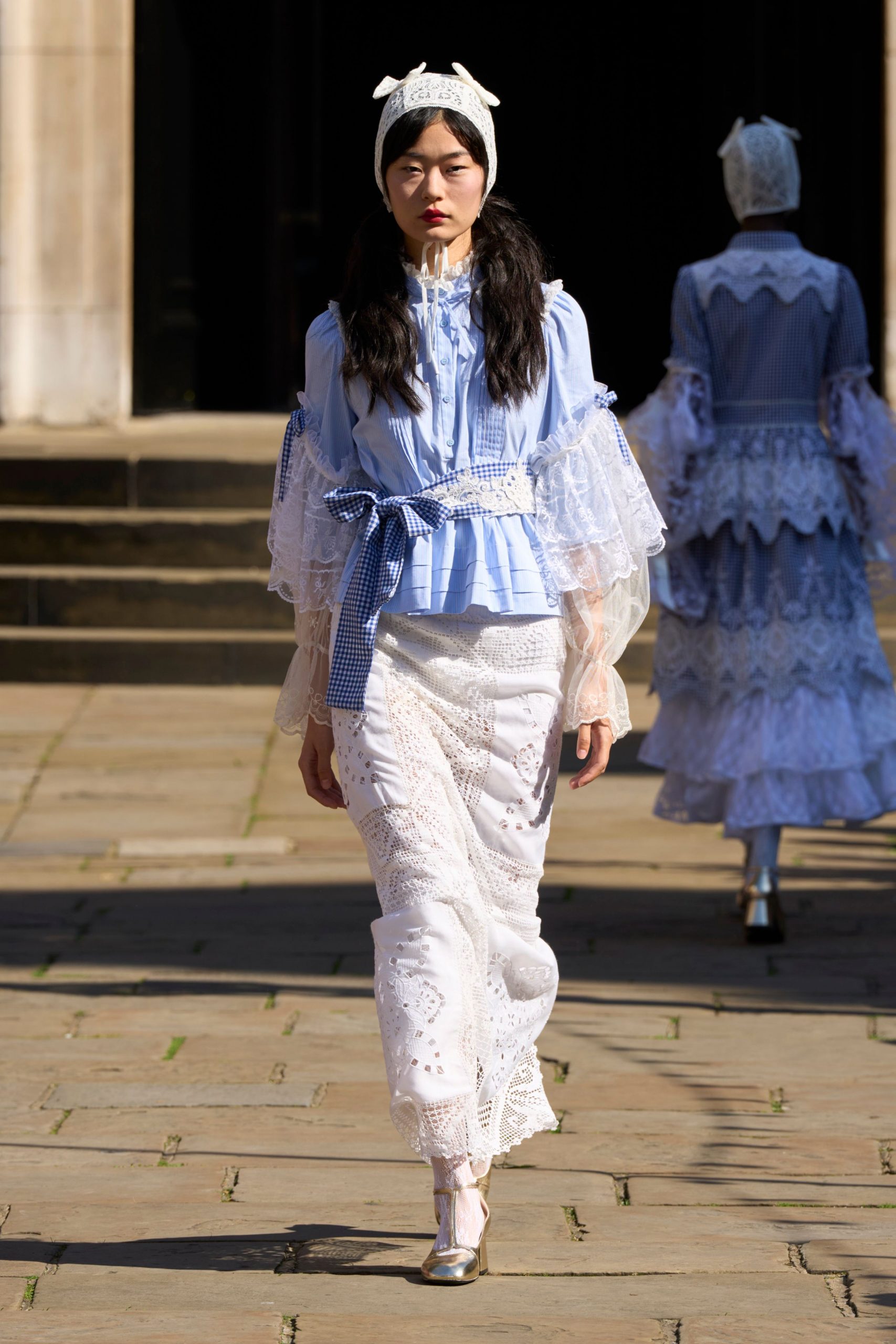 blue ruffled blouse with white lace skirt