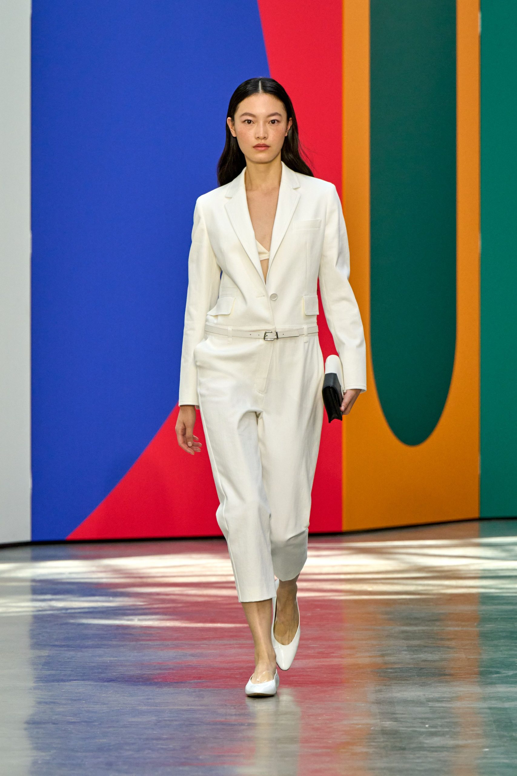 white tailored suit with clutch