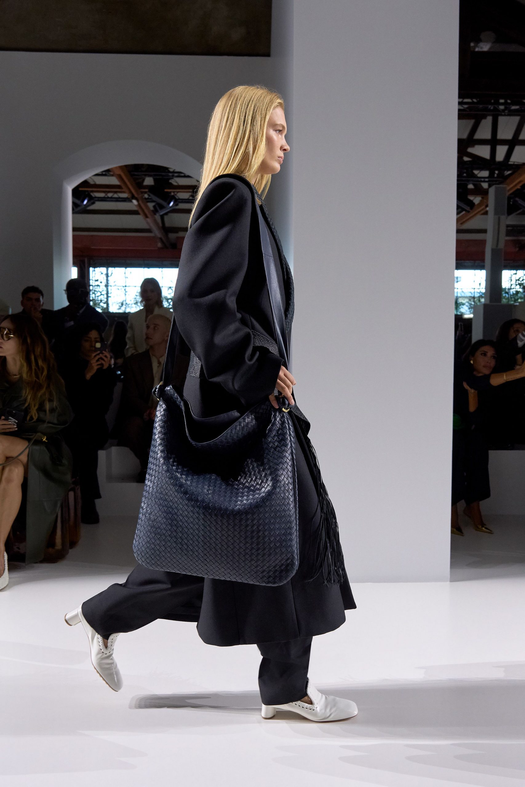 black wool long-sleeve collared oversized layered coat