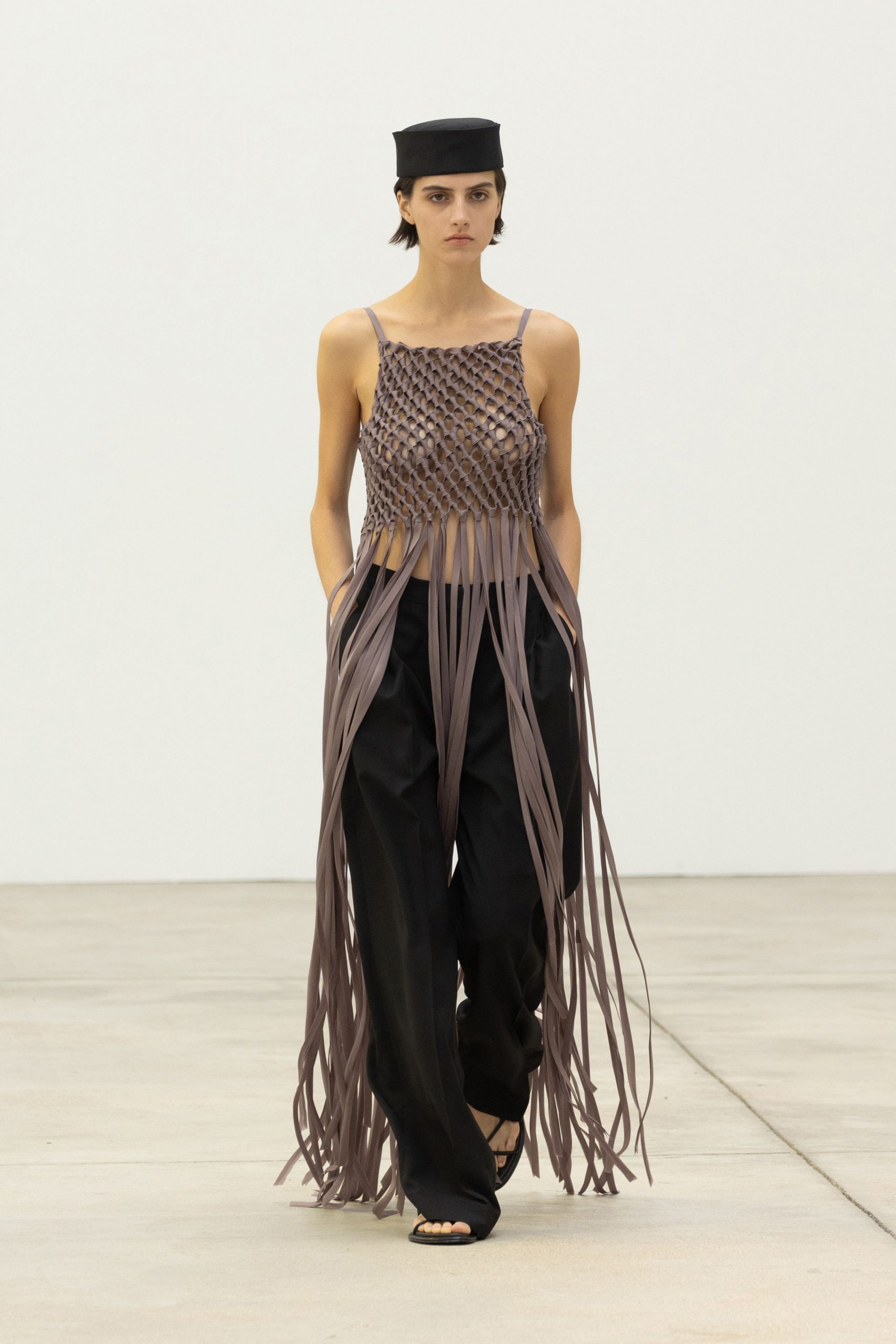 brown fringed top with black pants