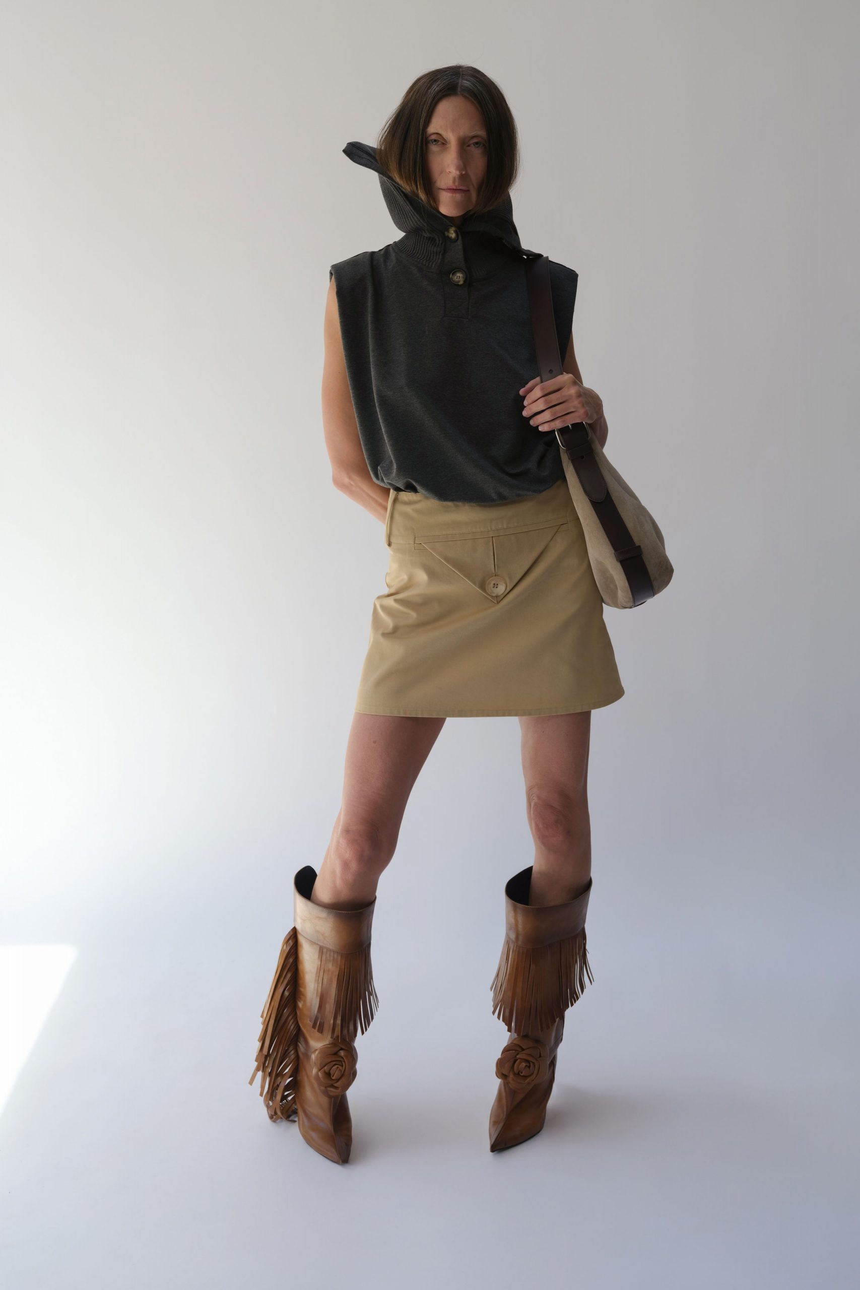 black fitted top beige skirt