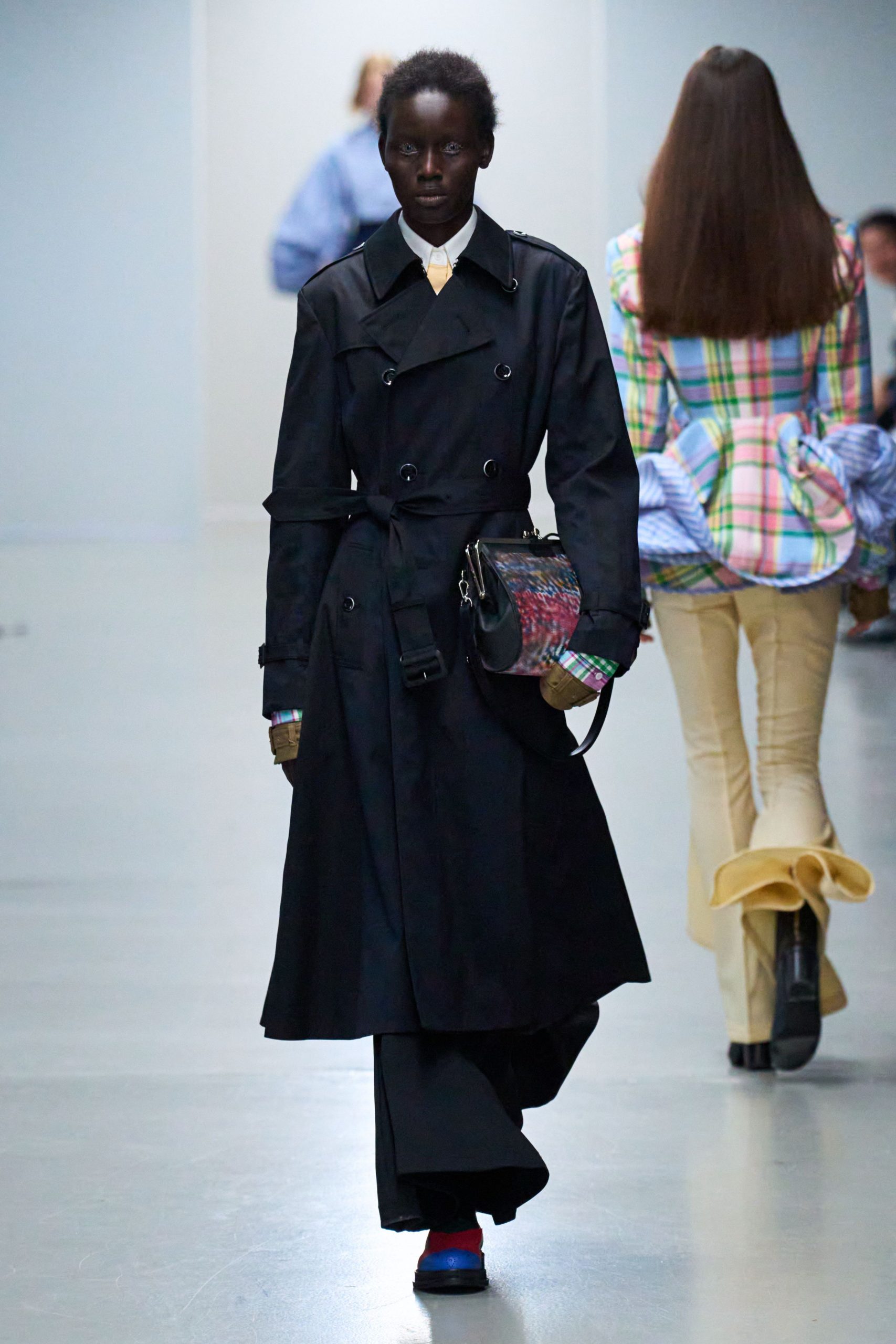 black trench coat with shirt and pants
