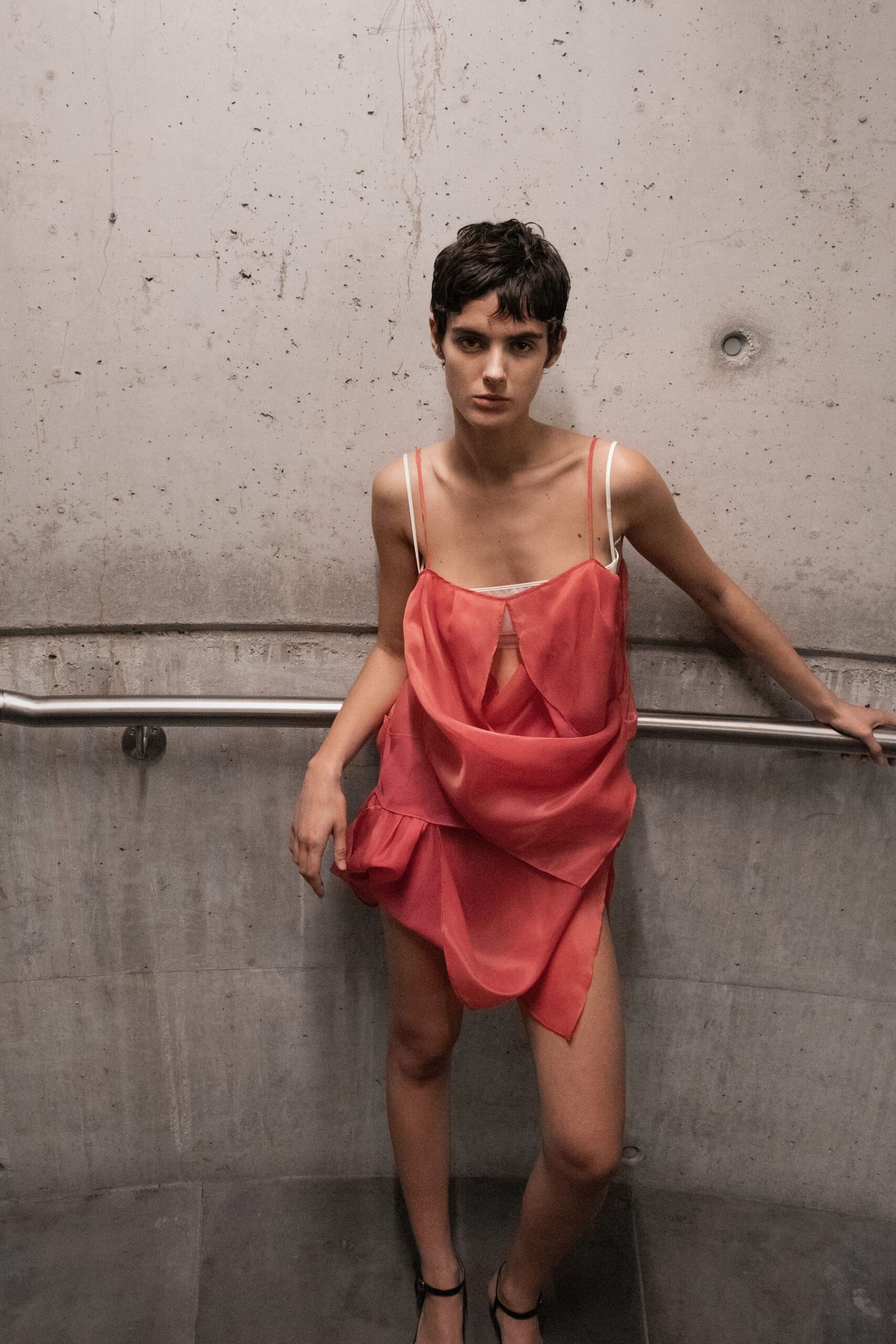 red silk sleeveless v-neck fitted draped flowing dress