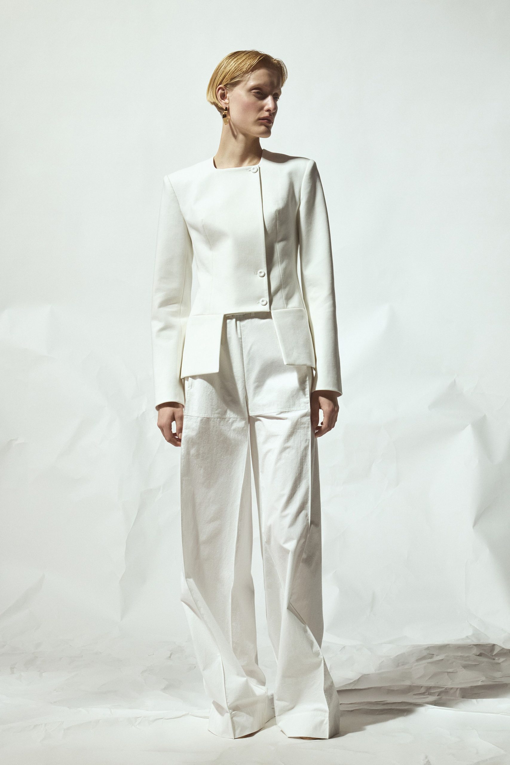 white structured blazer and relaxed pants