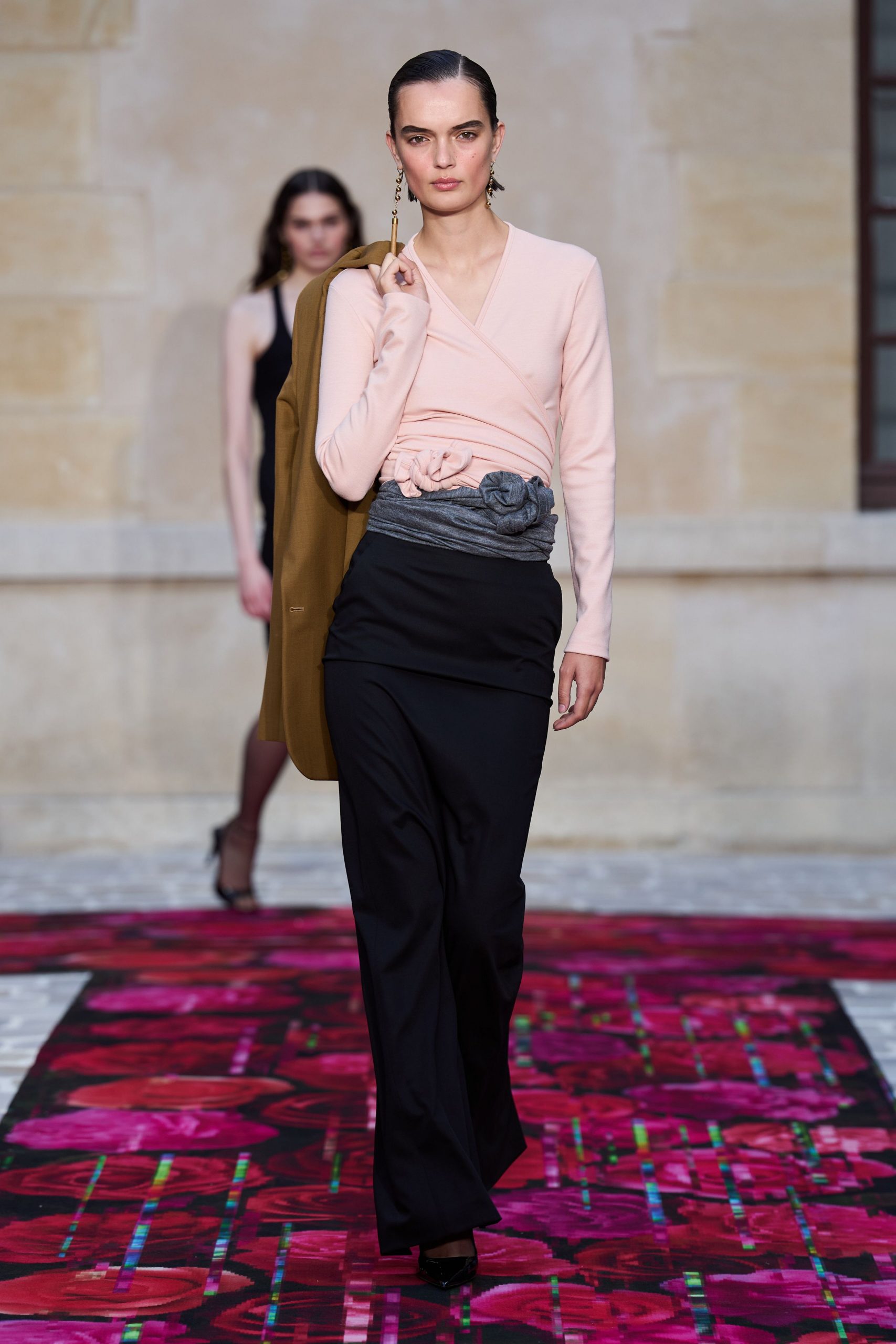 pink fitted top with black skirt