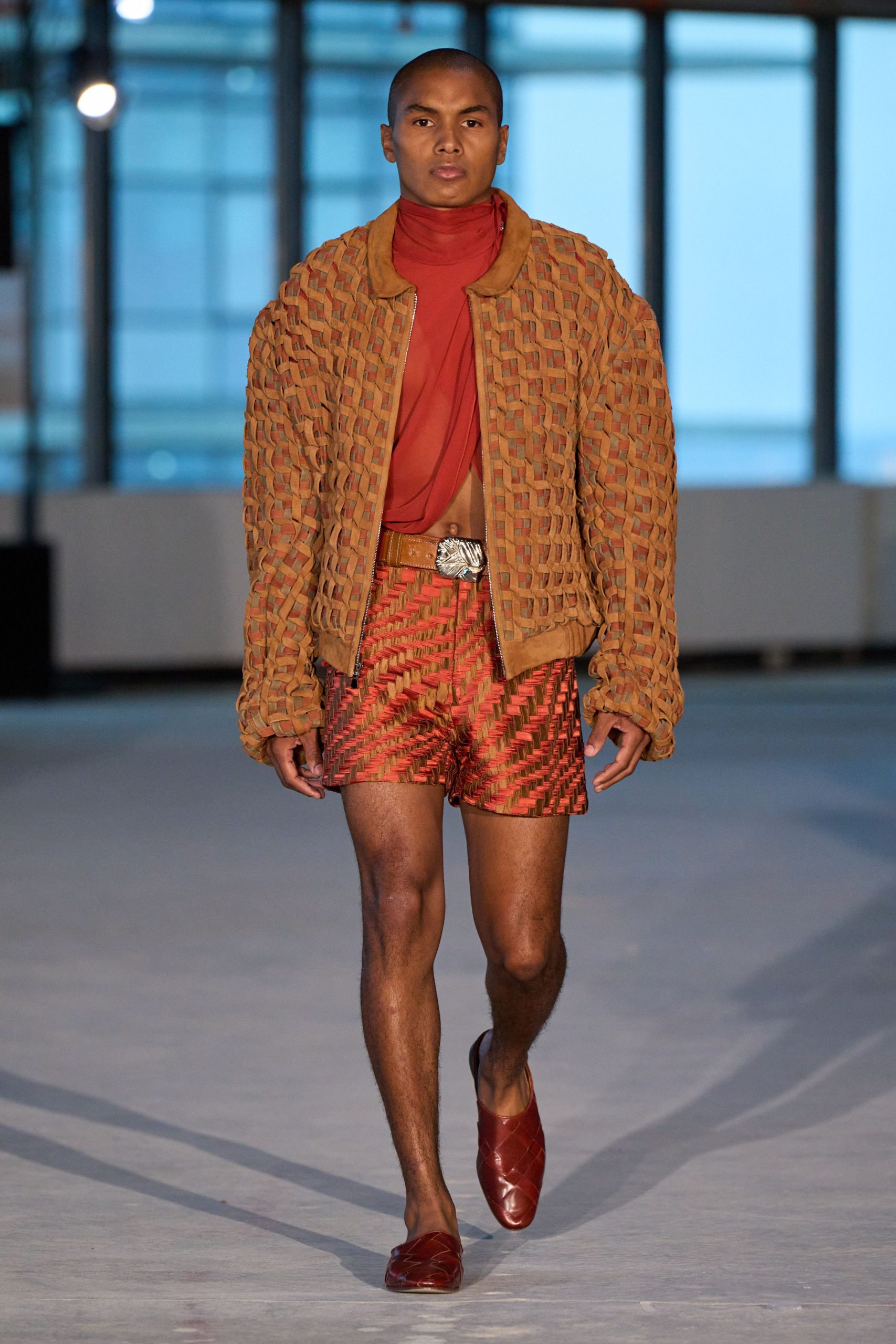 brown textured jacket with red top