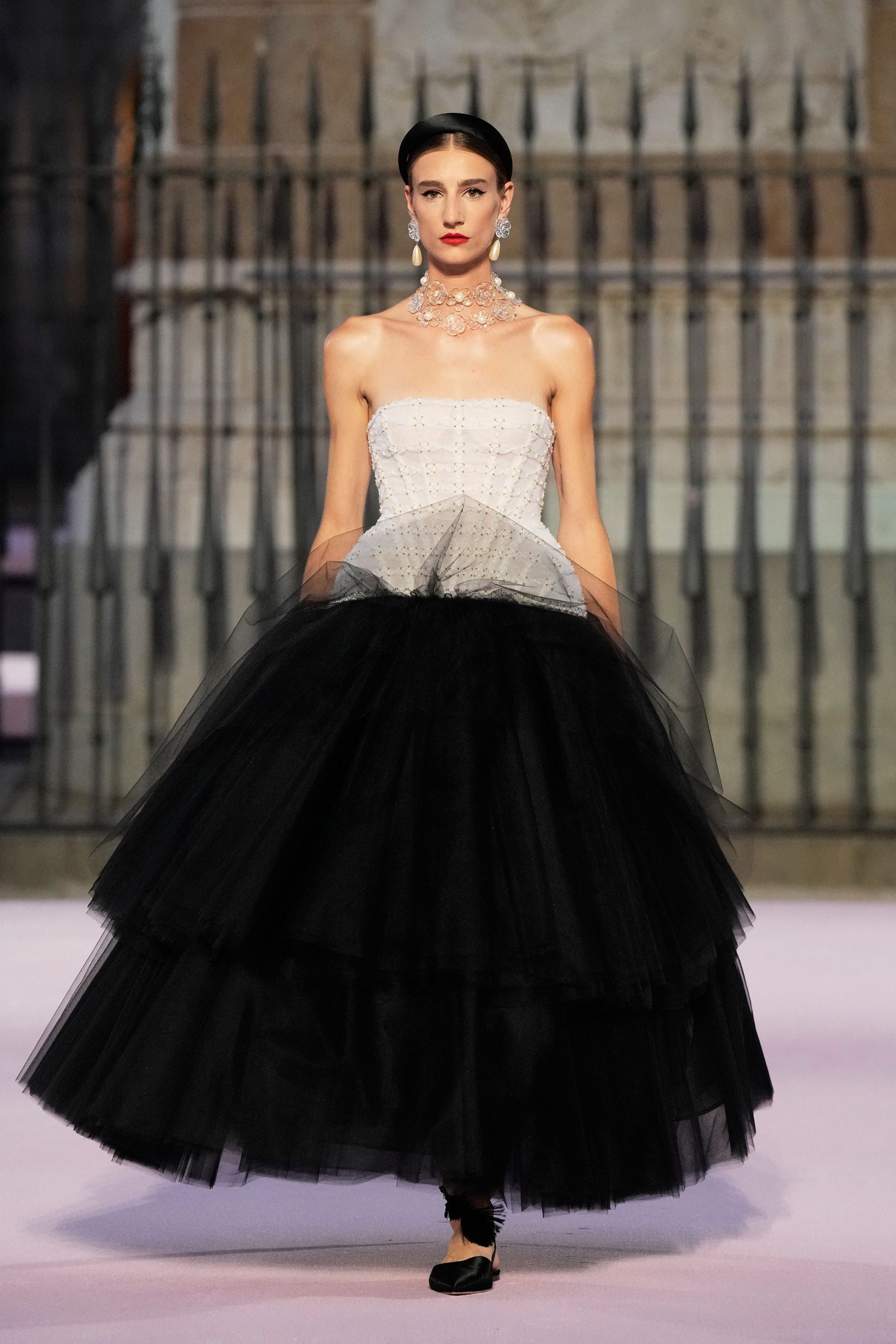 white tulle strapless fitted tiered ruffled flowing gown