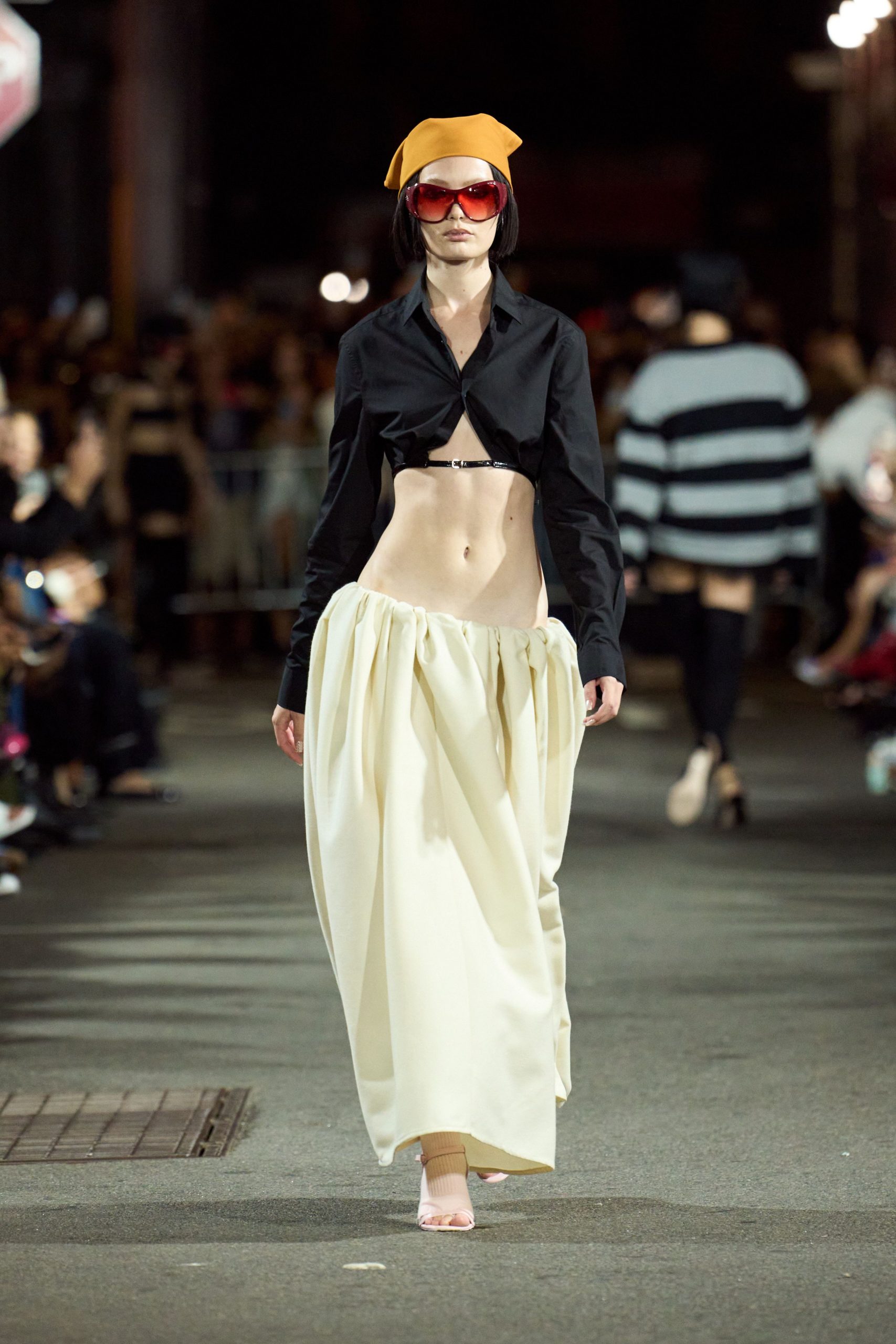 black shirt white pleated skirt