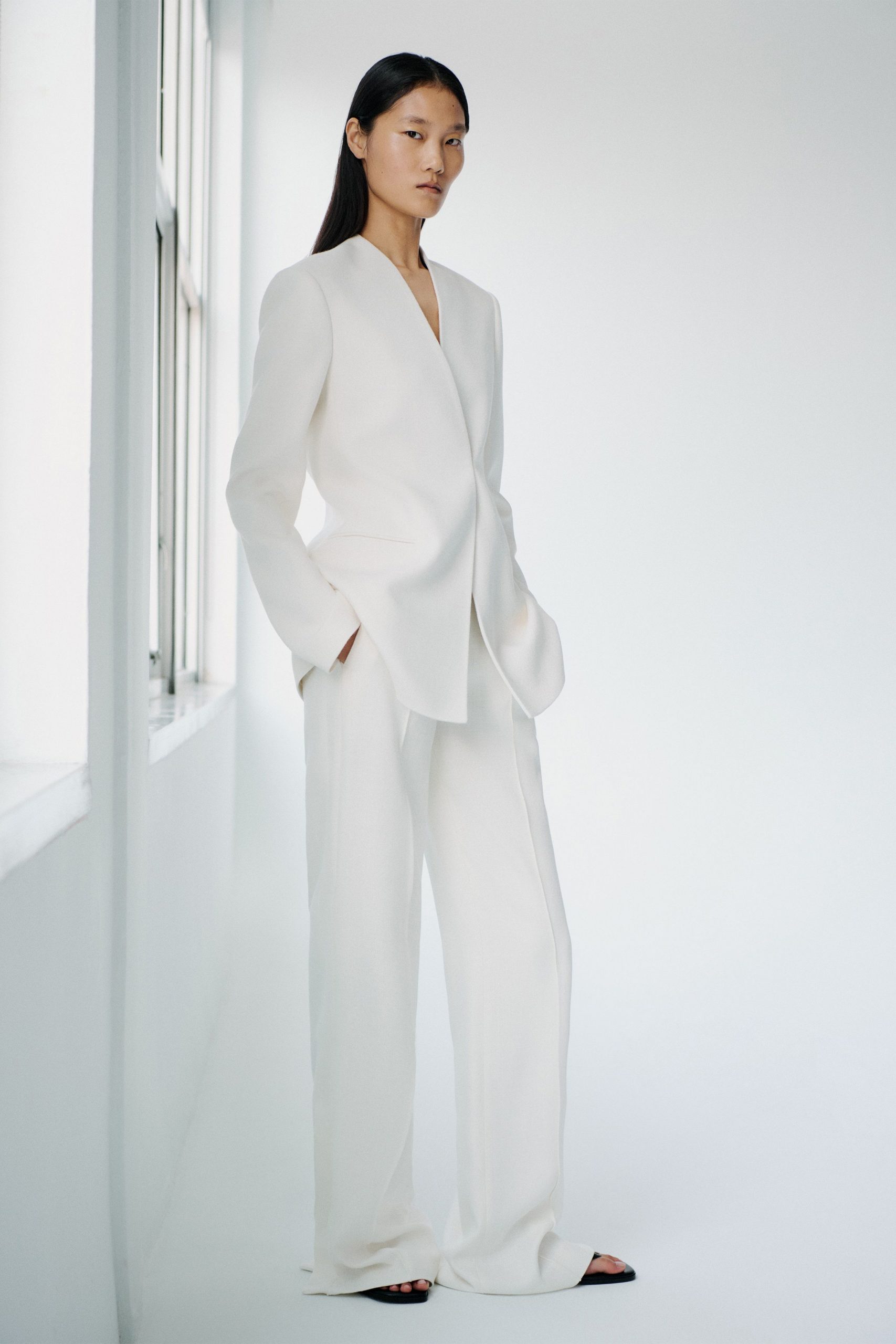 white tailored suit with black shoes