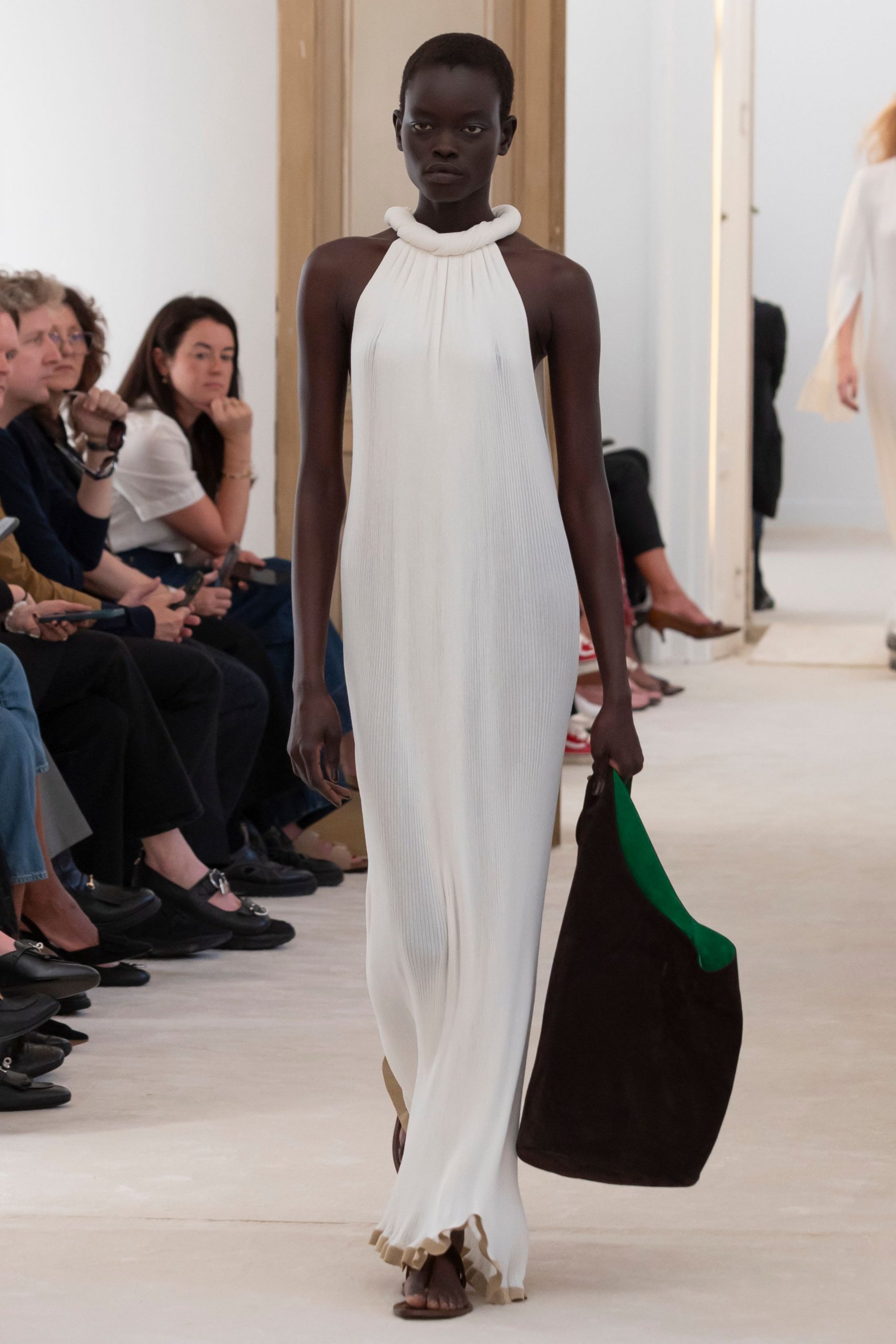 white pleated maxi gown with bag