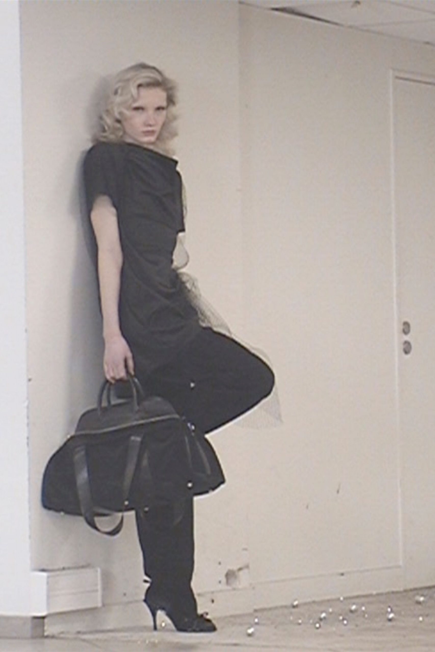 black fitted jumpsuit with bag and shoes