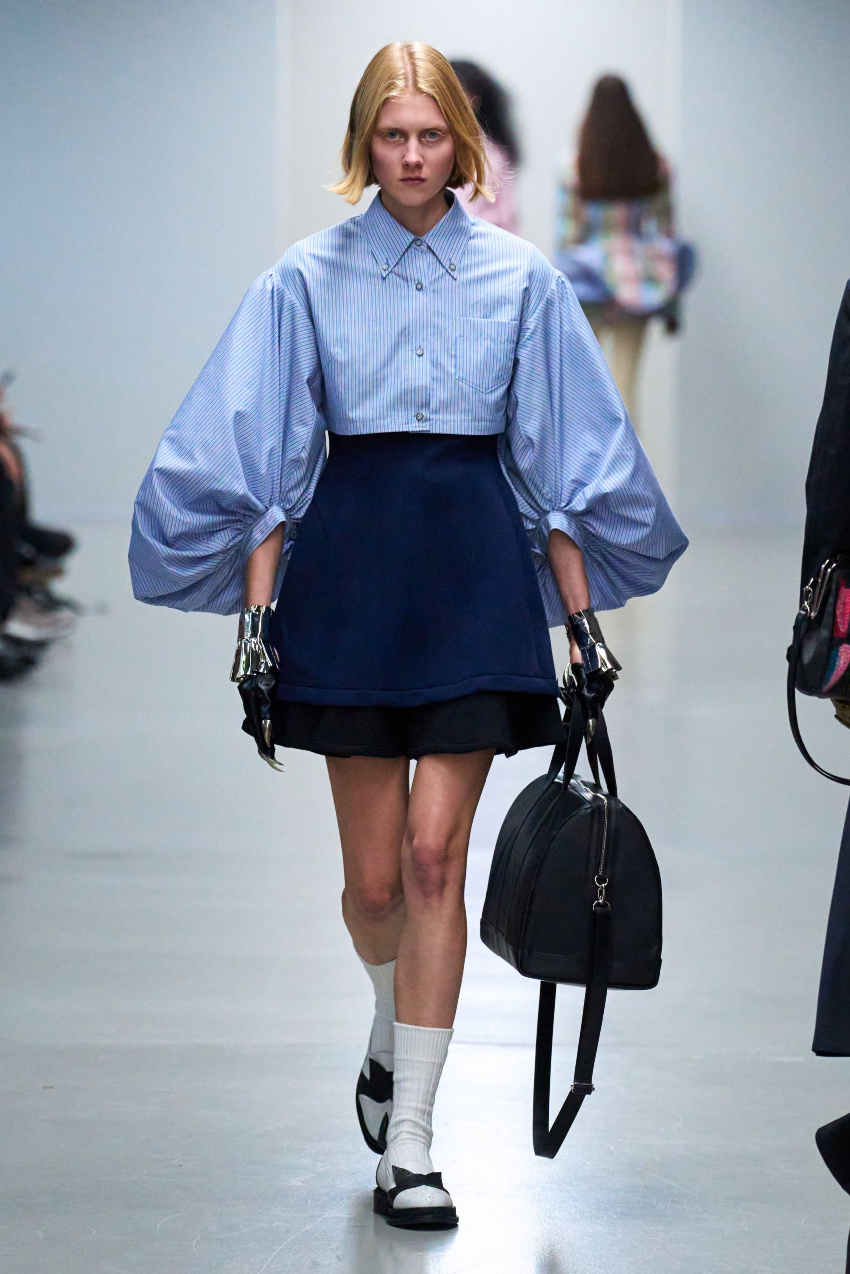 blue and white pleated shirt with navy skirt