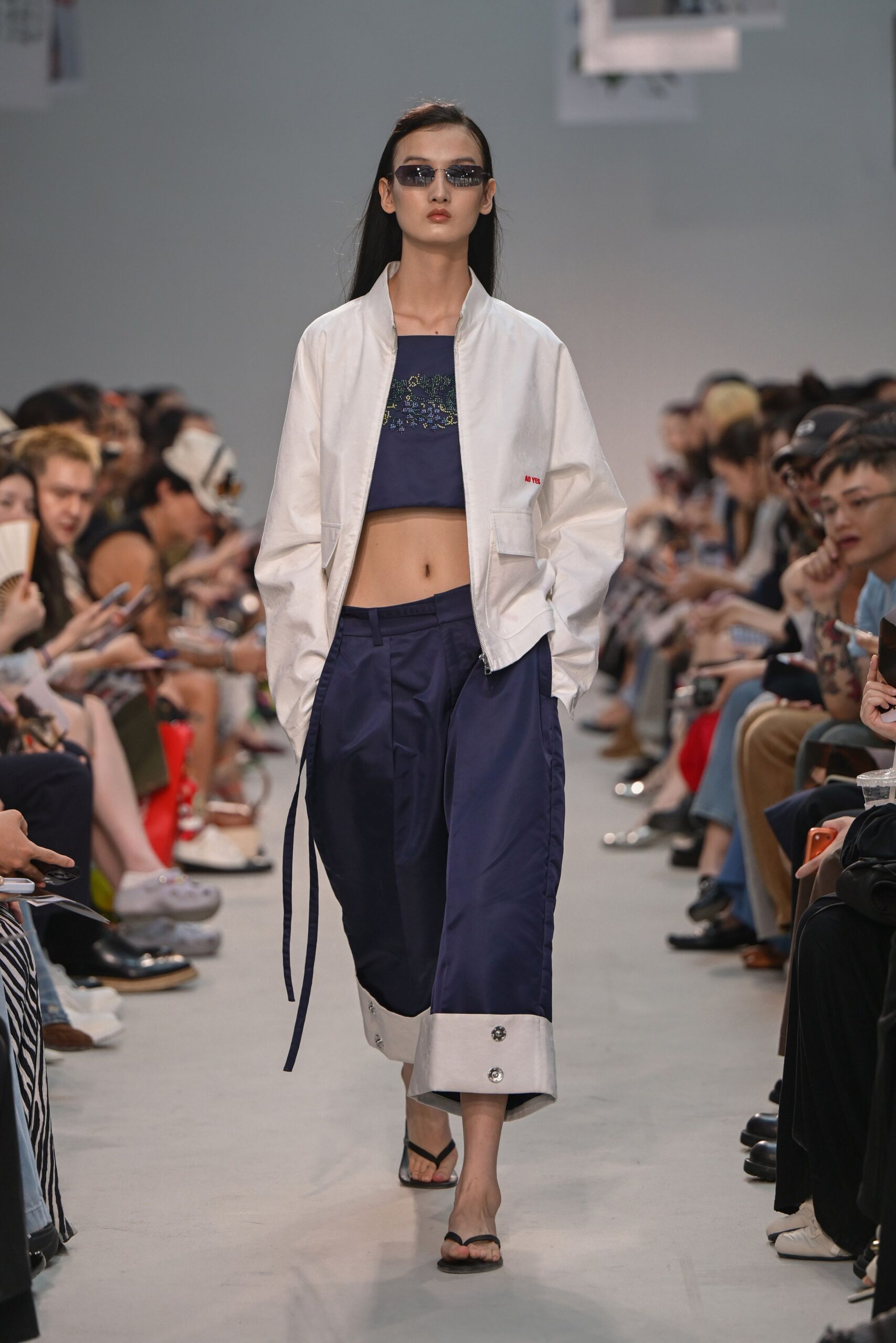 white jacket blue crop top