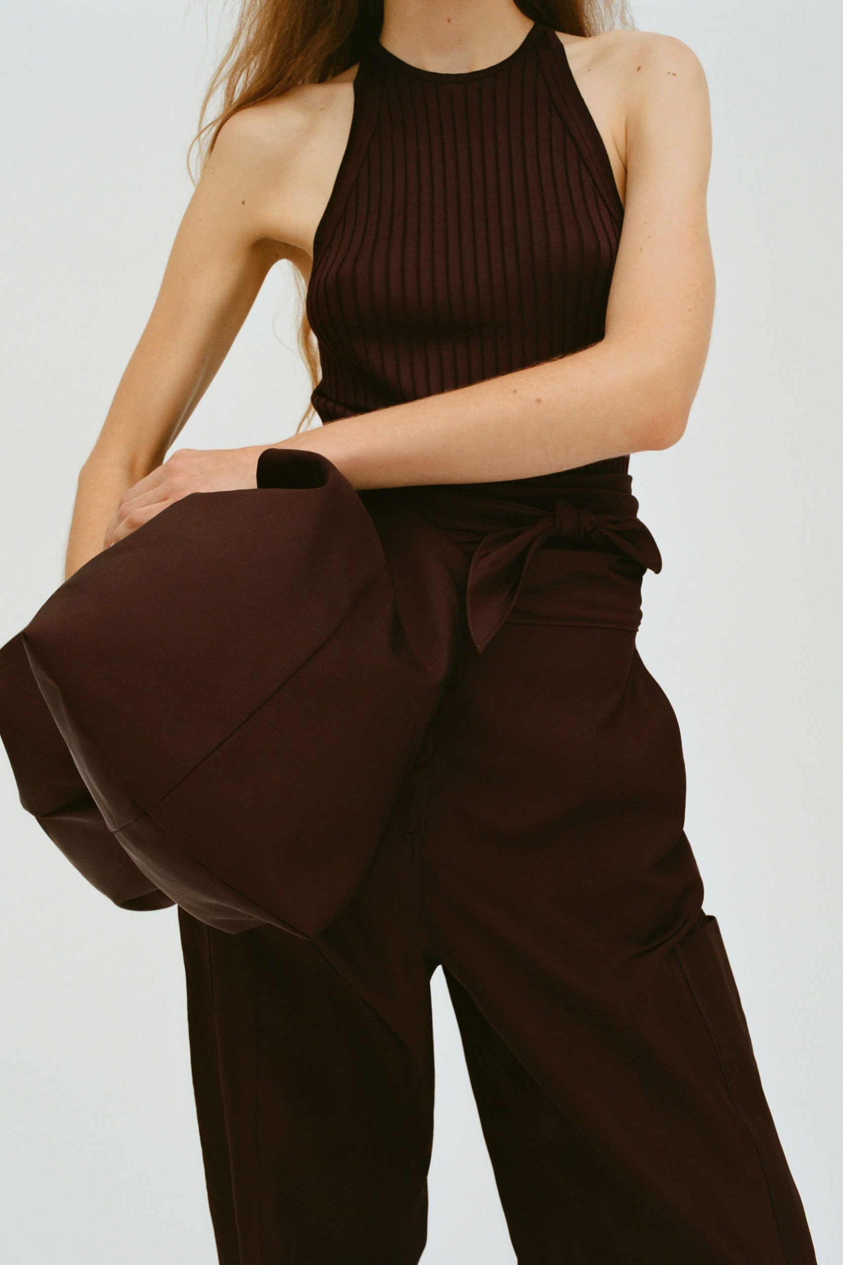 brown fitted top and relaxed pants