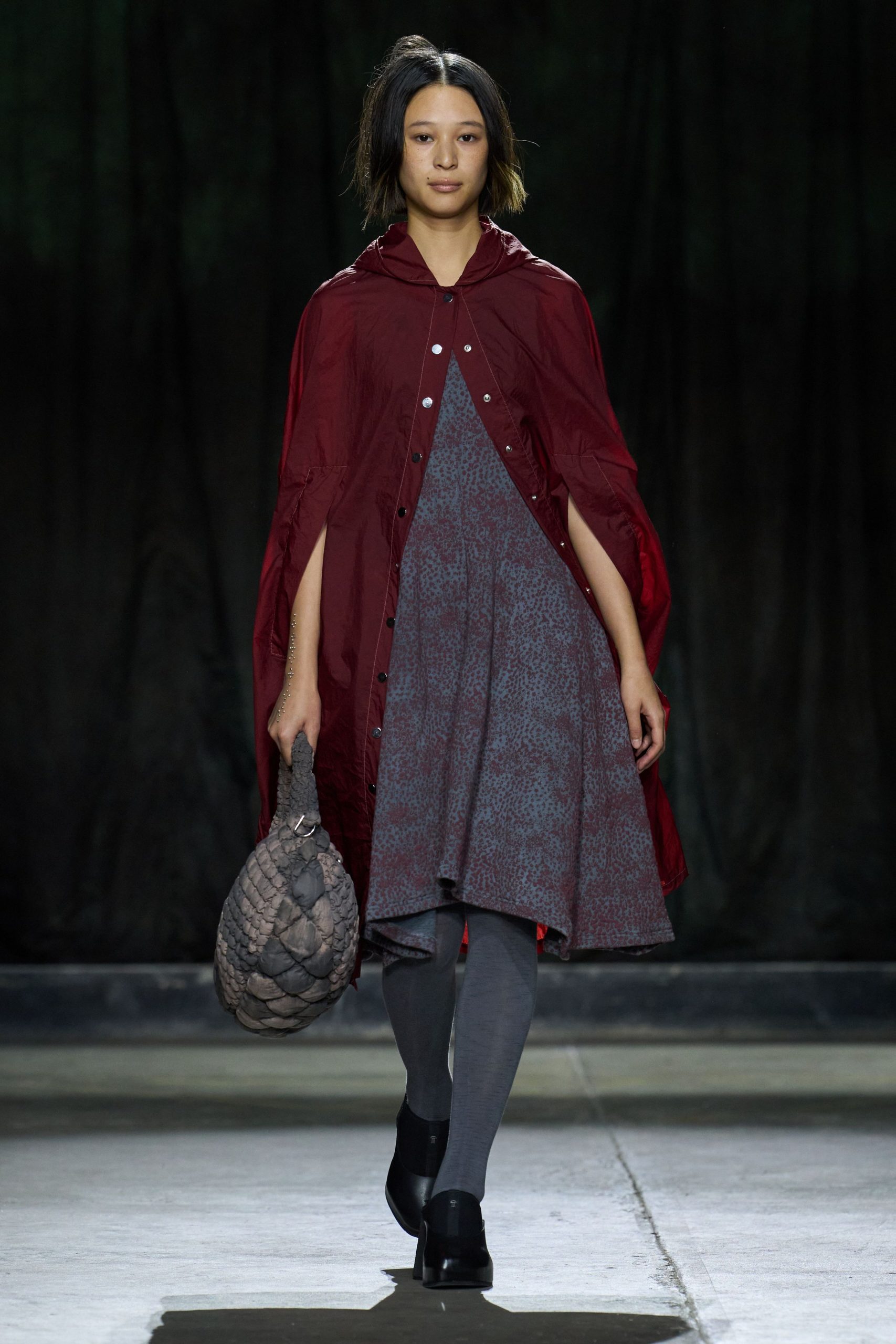 gray relaxed dress with red cape