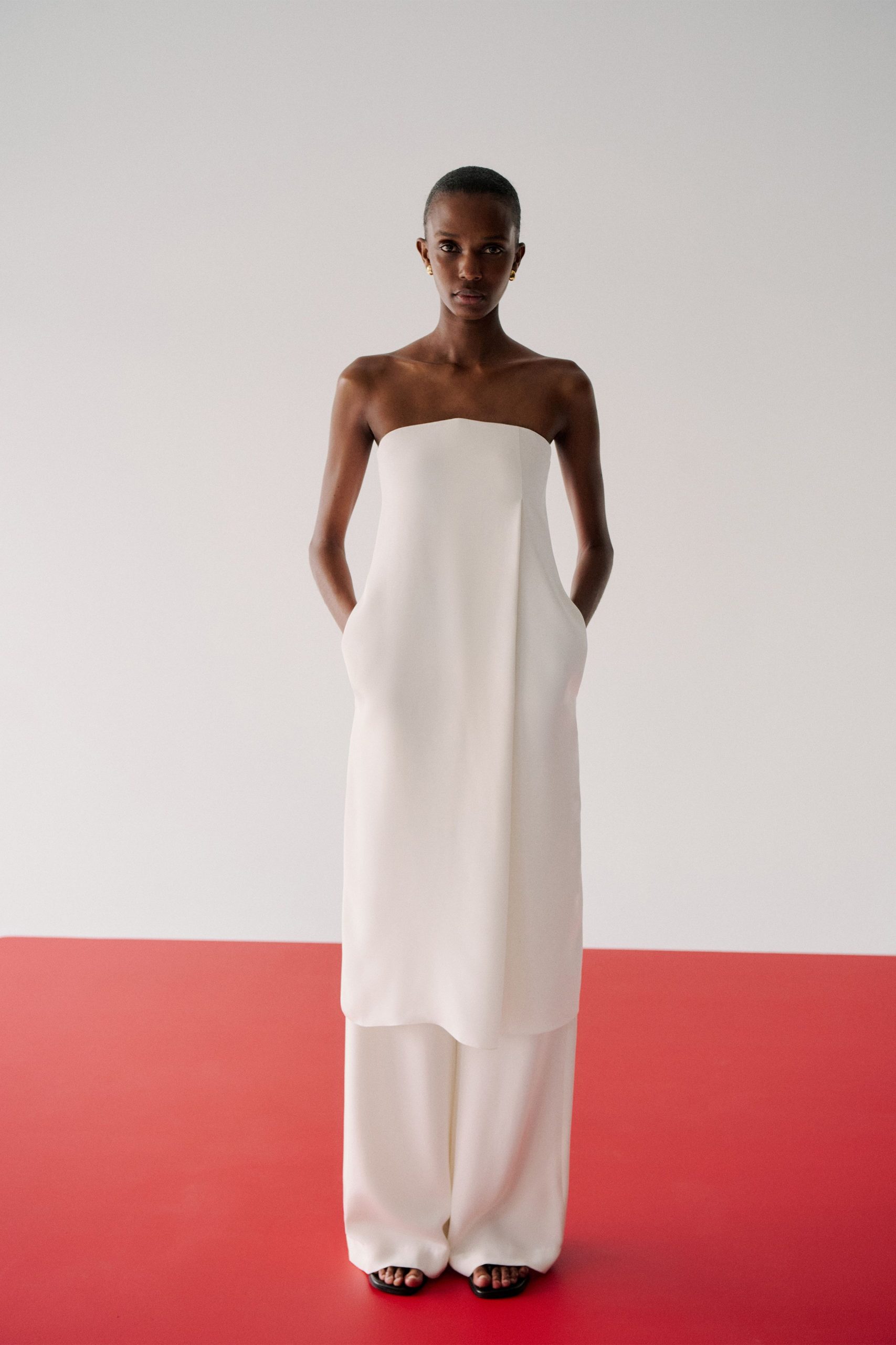 white silk strapless relaxed pockets flowing maxi gown