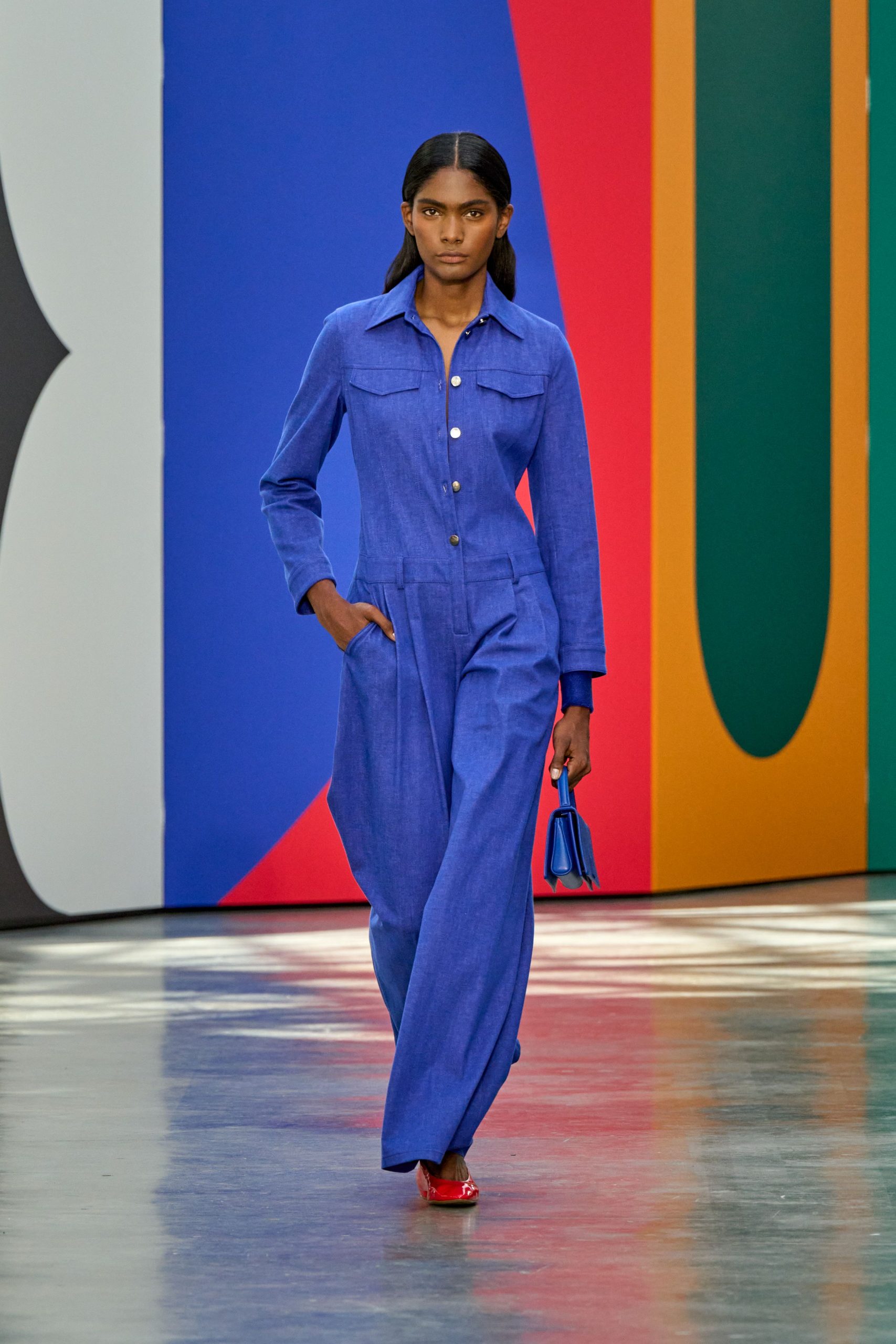 blue cotton jumpsuit with red shoes