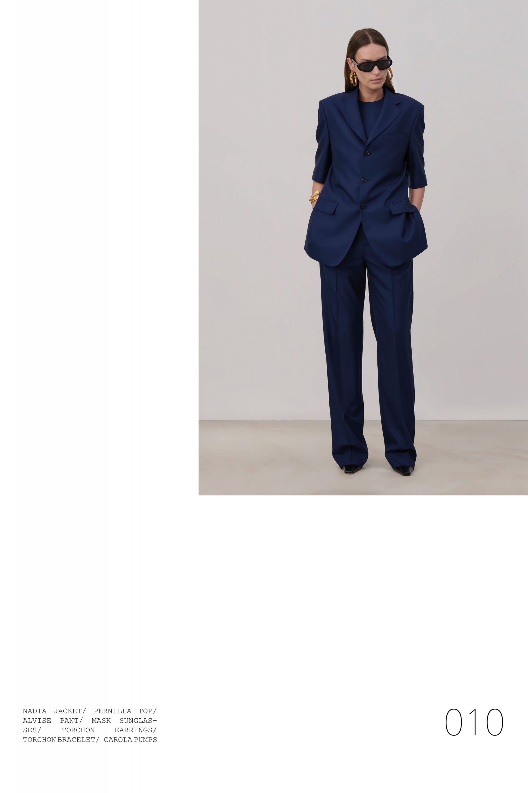 blue tailored suit with sunglasses