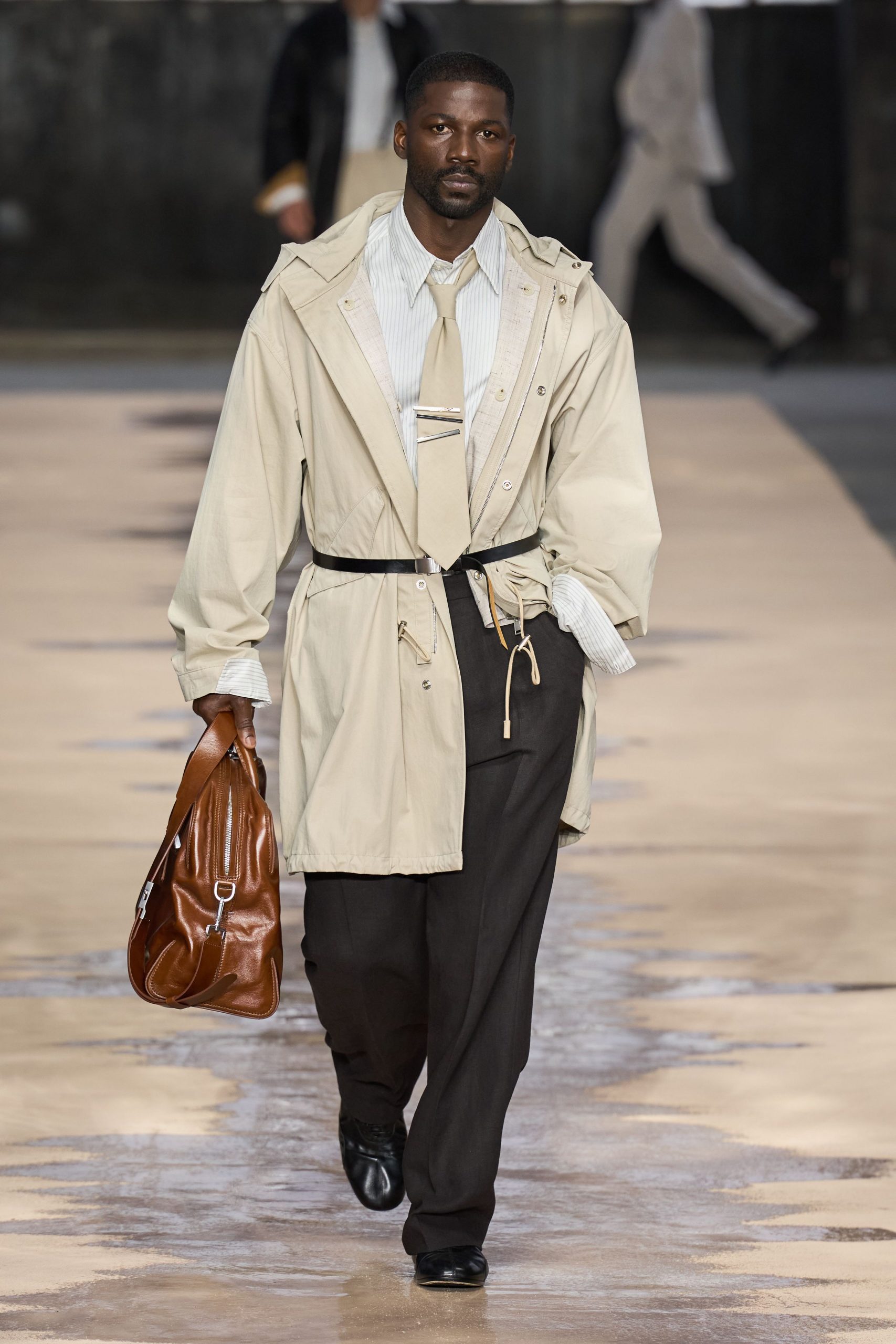 beige trench coat with black pants