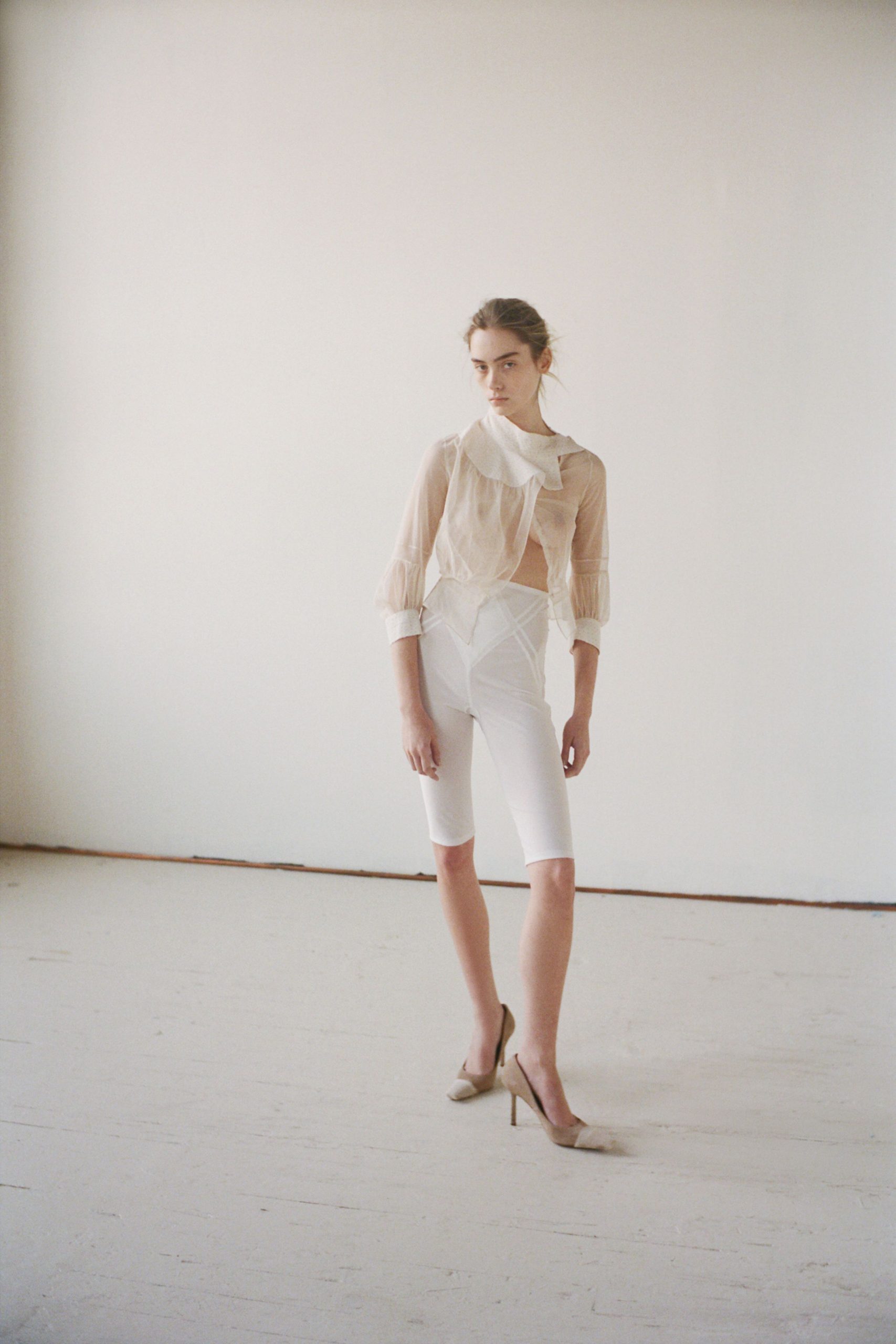 white chiffon long-sleeve collared fitted ruffled sheer blouse