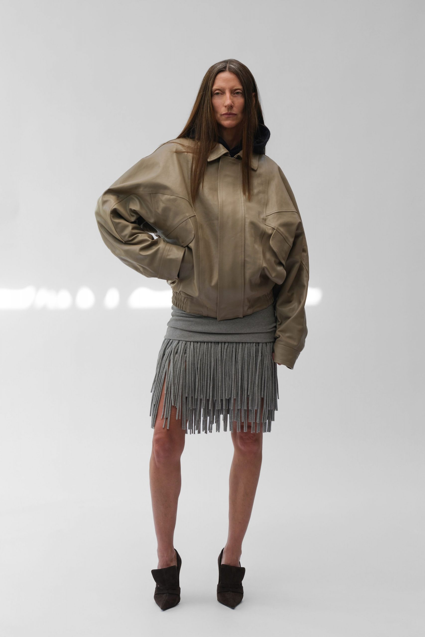 beige leather oversized jacket with fringed gray skirt