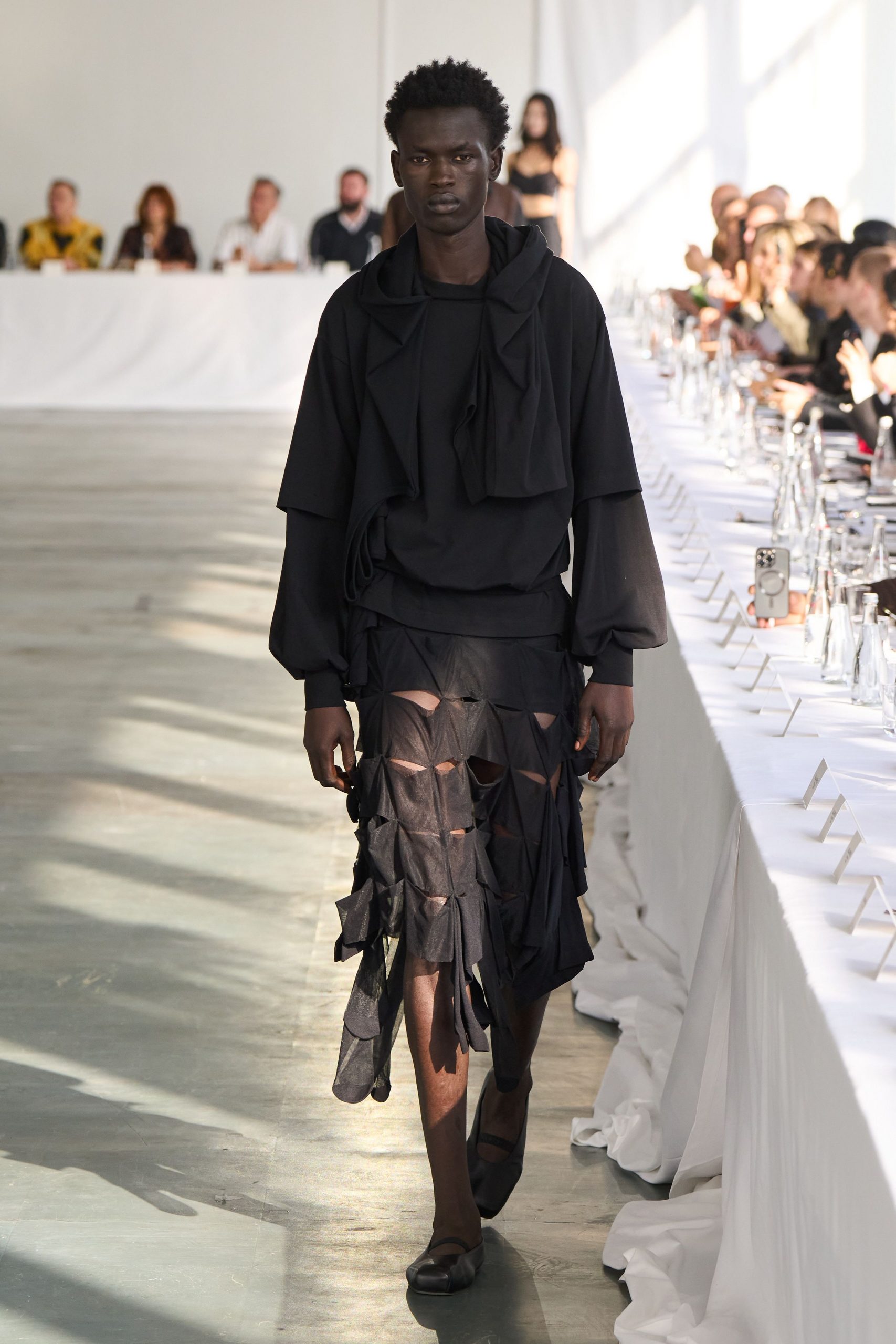 black relaxed top with pleated skirt