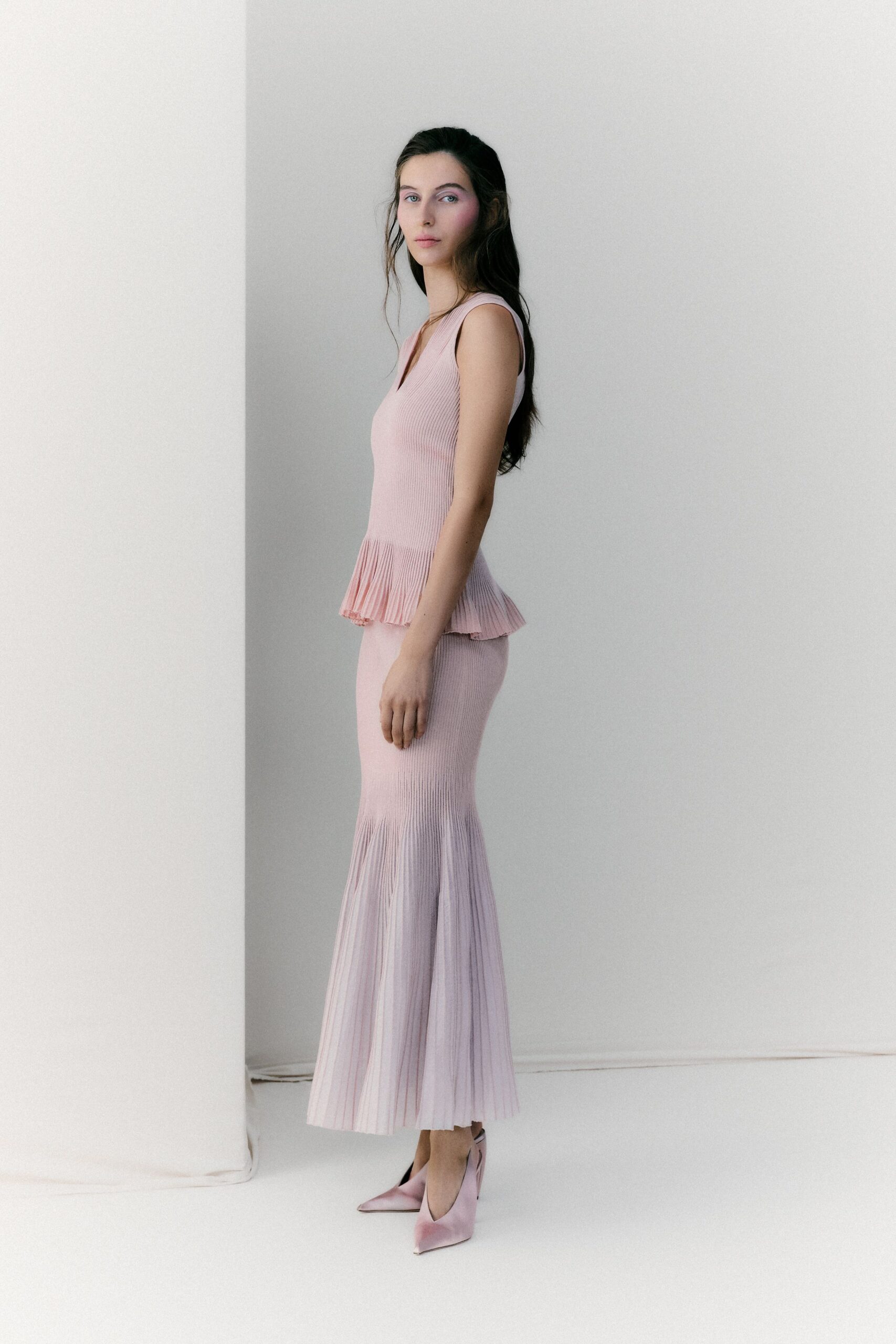 pink knit sleeveless v-neck fitted pleated tiered dress