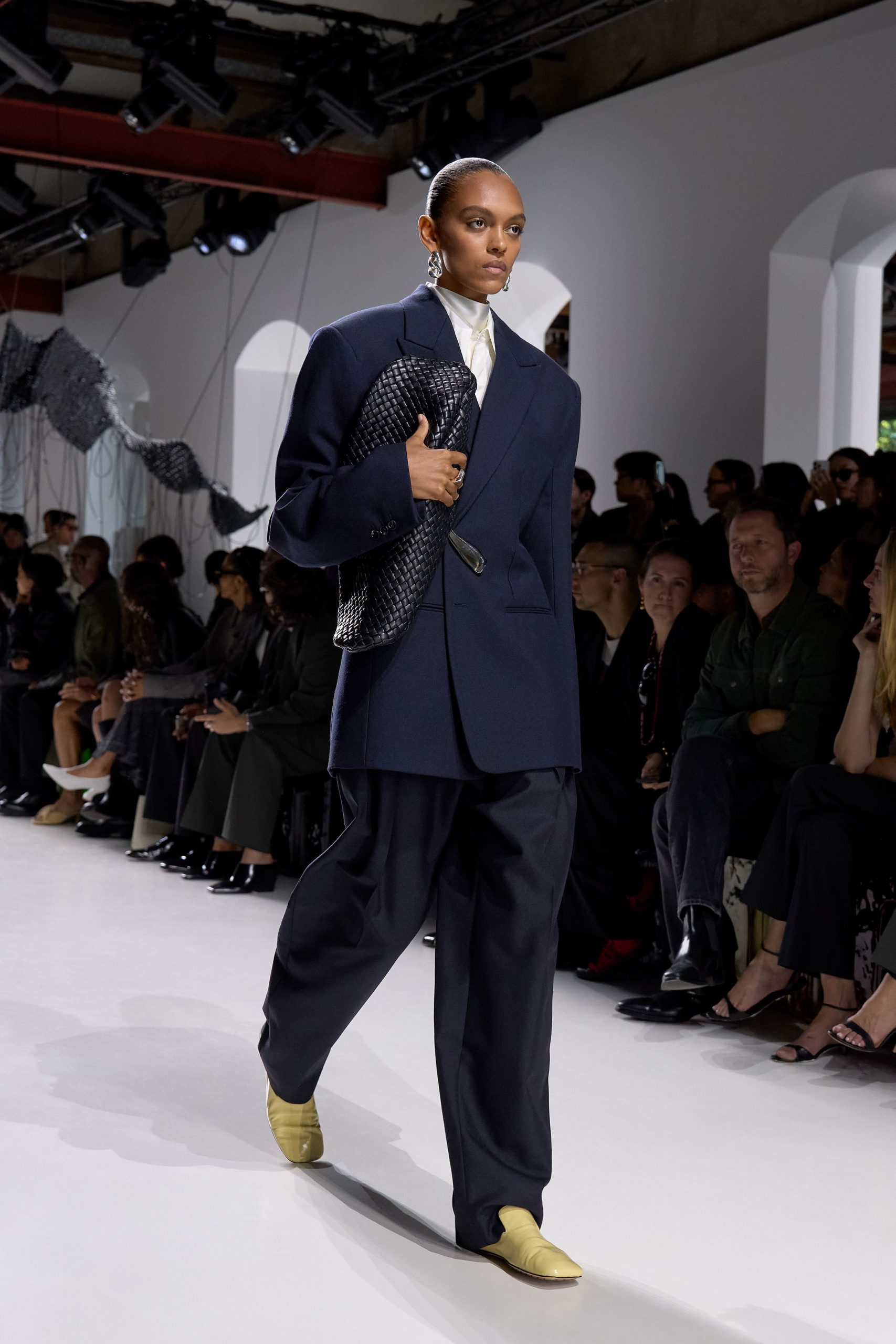 navy blazer black pants yellow shoes