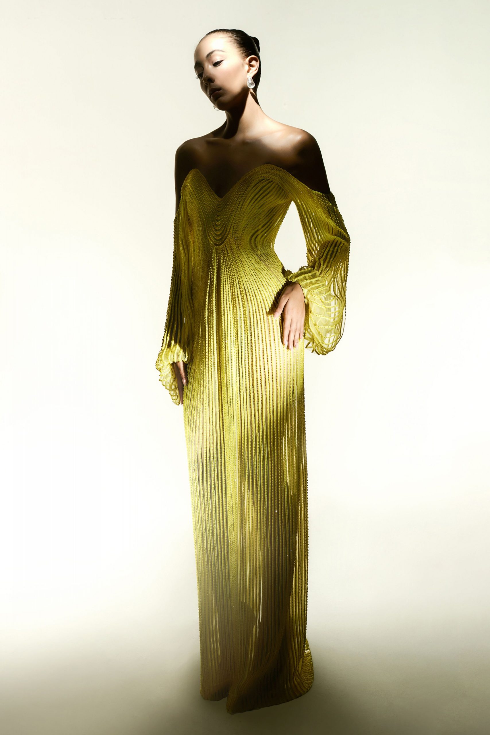 yellow pleated off-shoulder gown