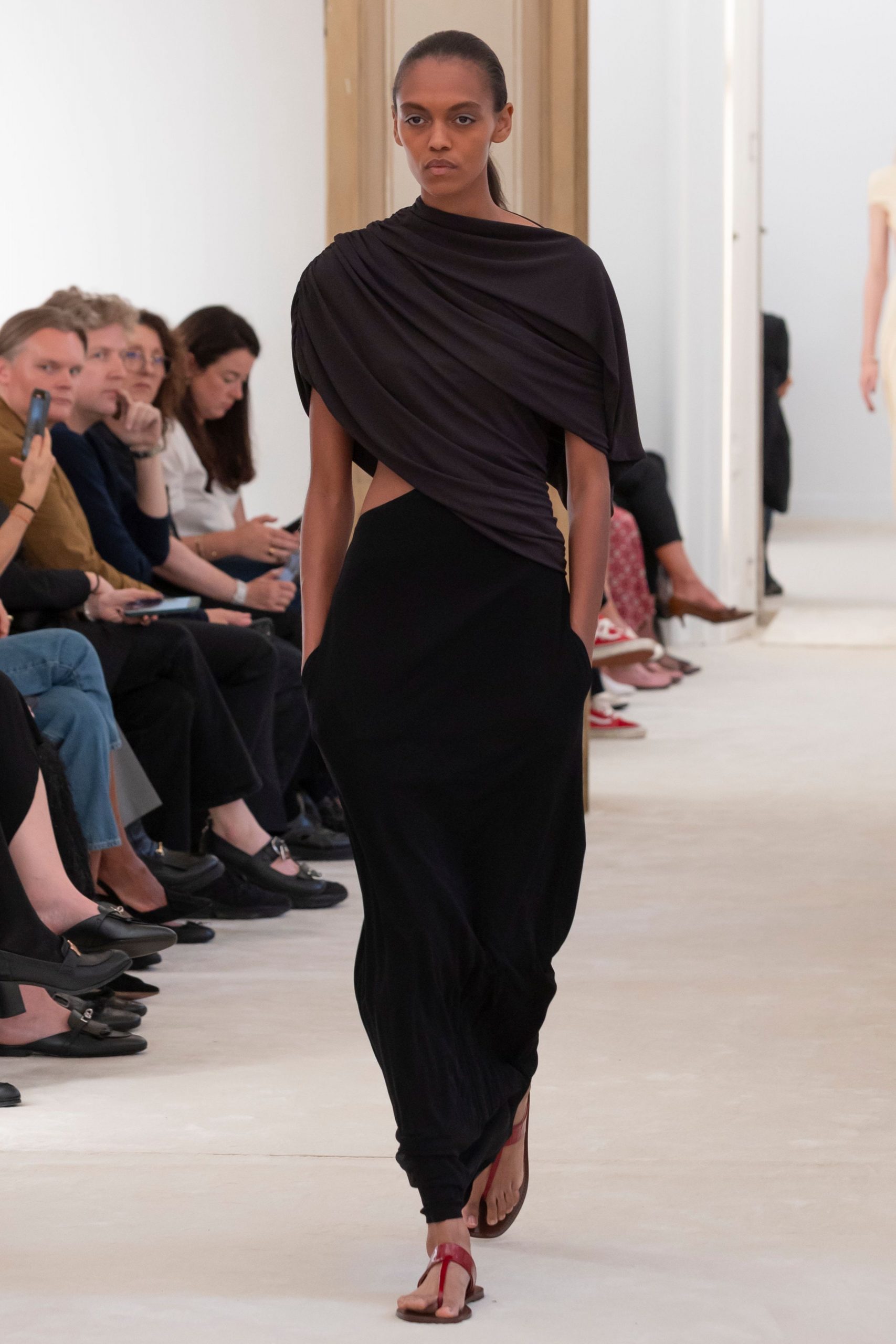 black draped maxi dress with red shoes