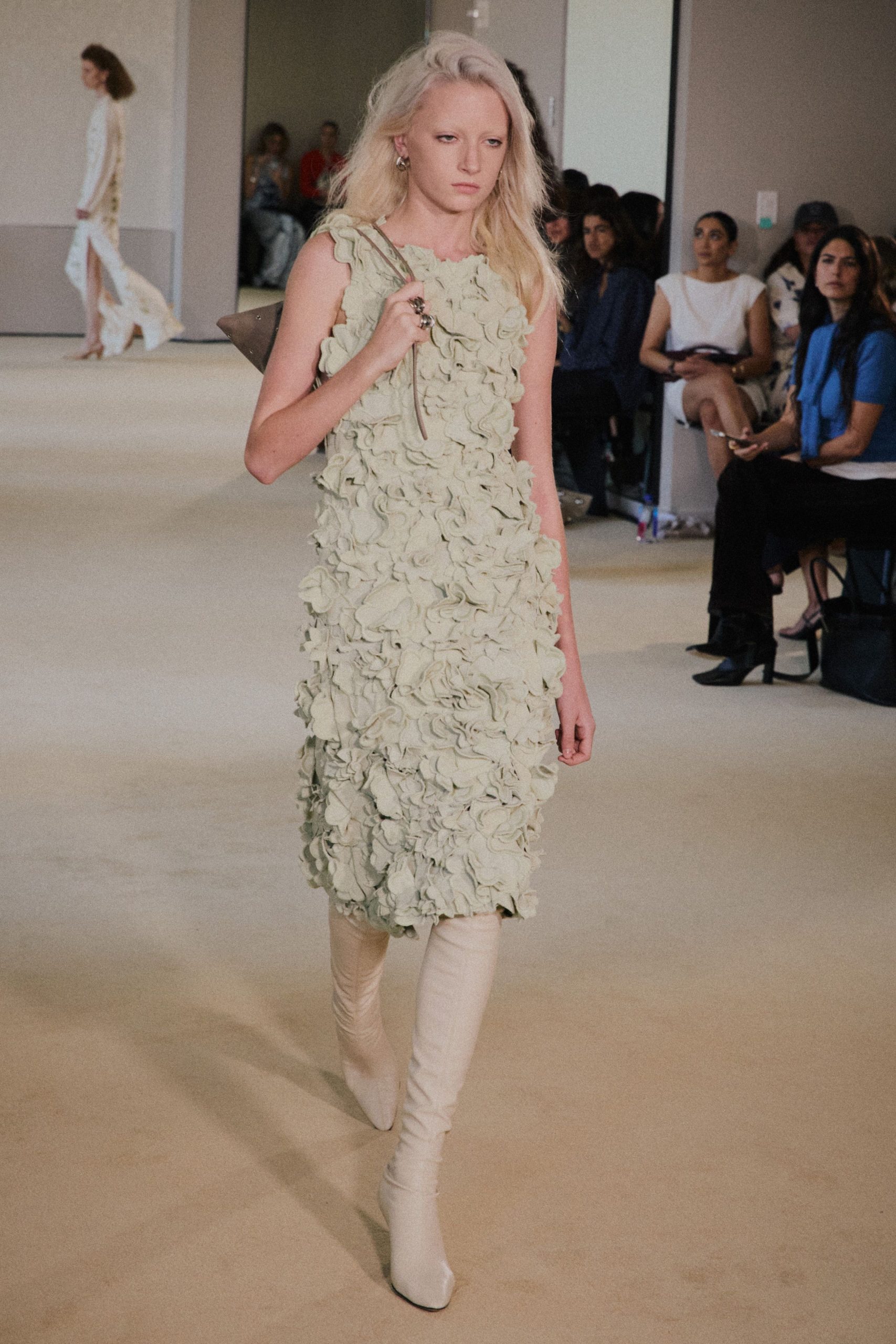 green ruffled midi dress with white boots