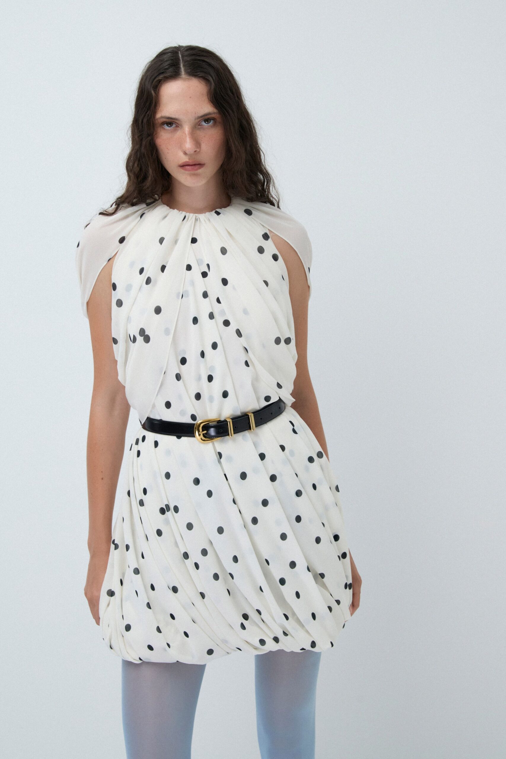 white silk sleeveless high-neck fitted pleated polka-dot dress