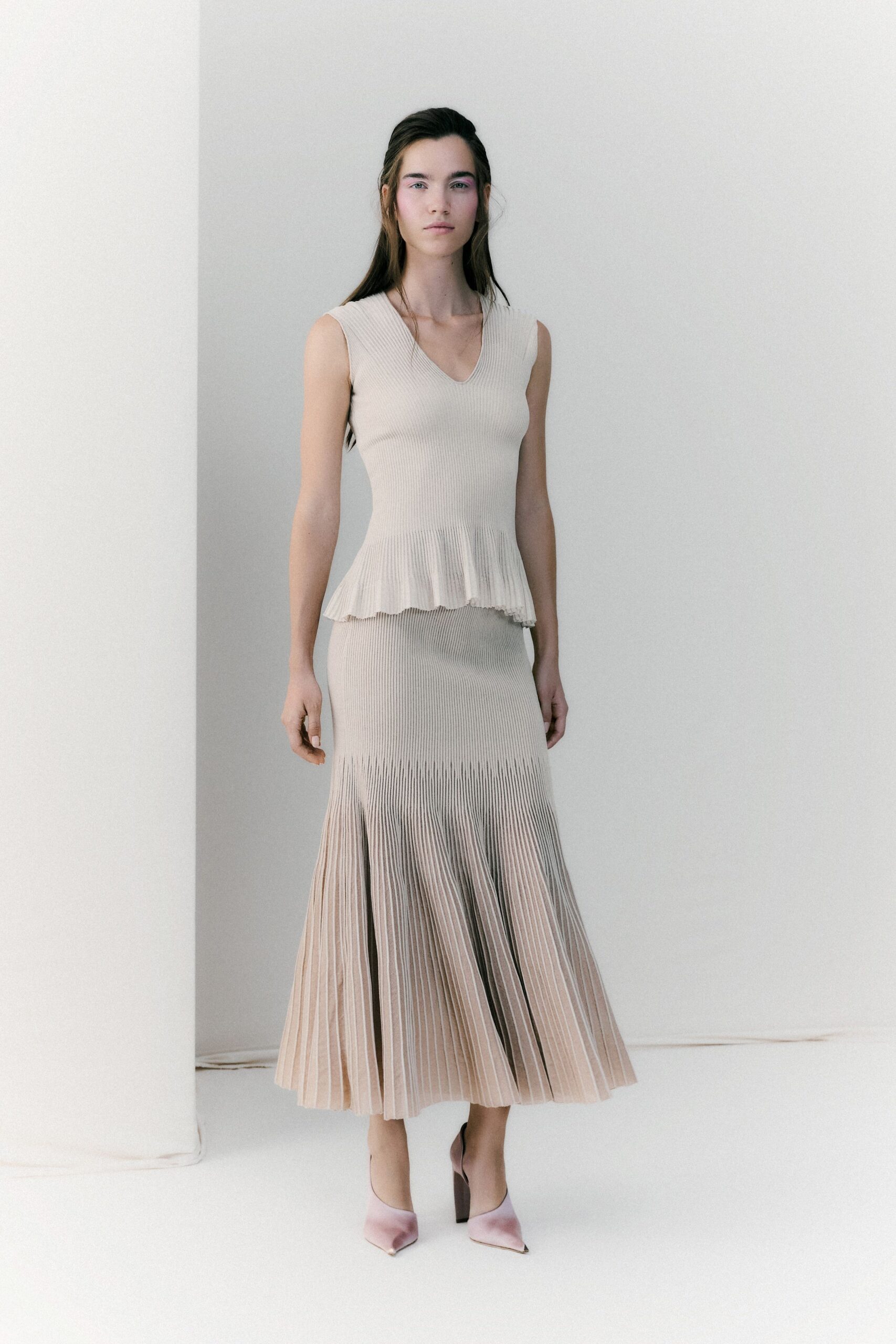 beige knit sleeveless v-neck fitted pleated tiered dress
