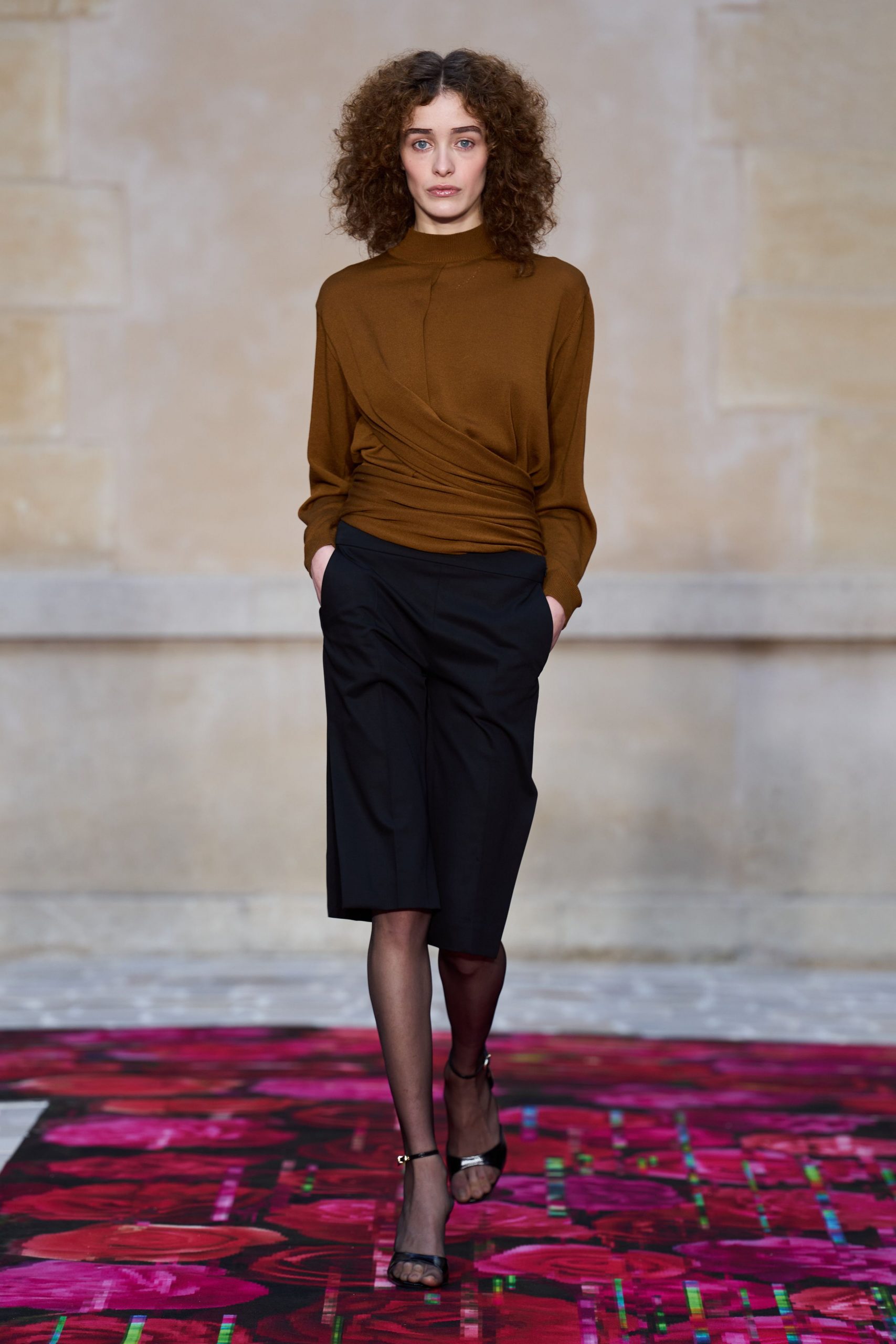 brown fitted top with black pants