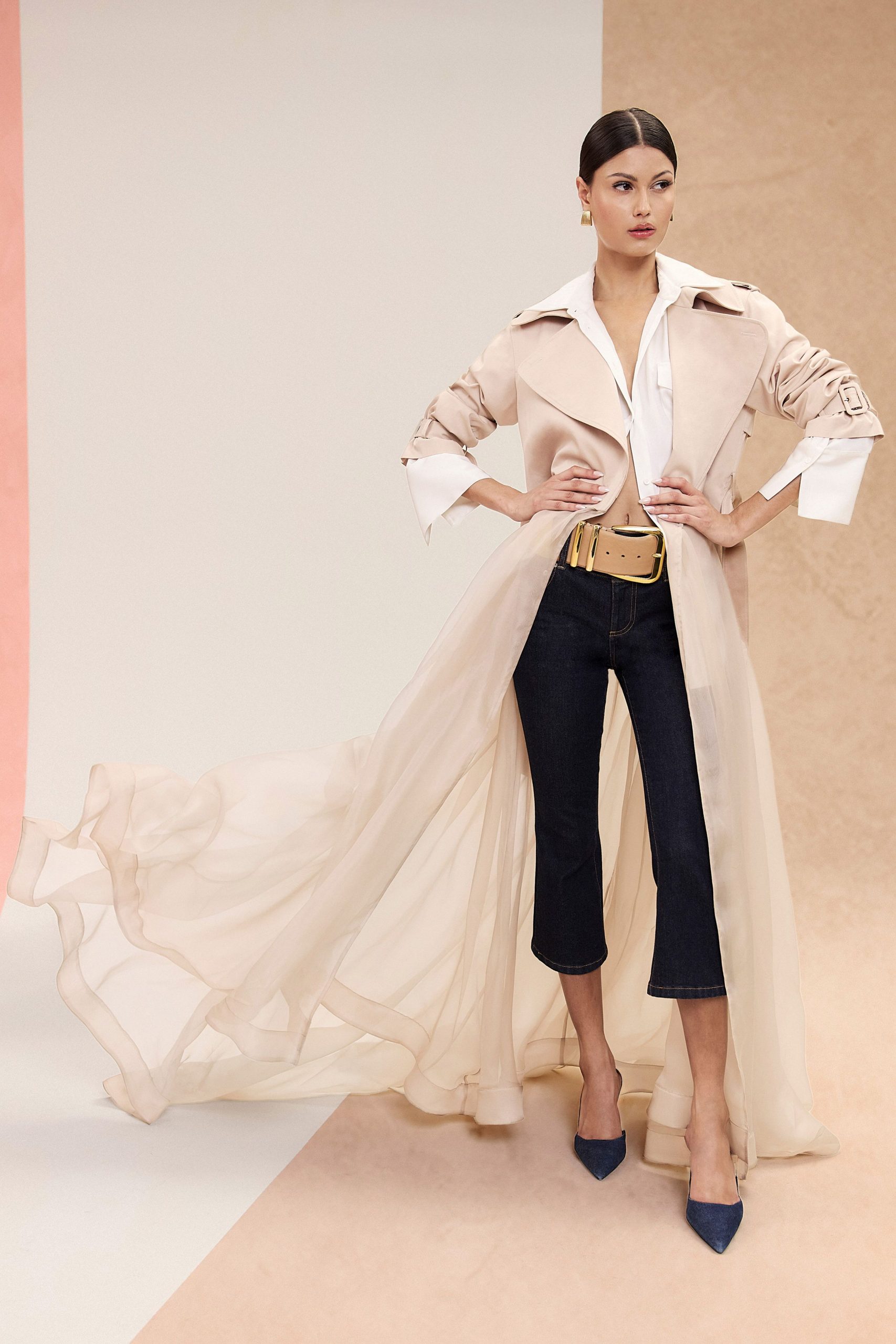 beige trench coat with flowing details