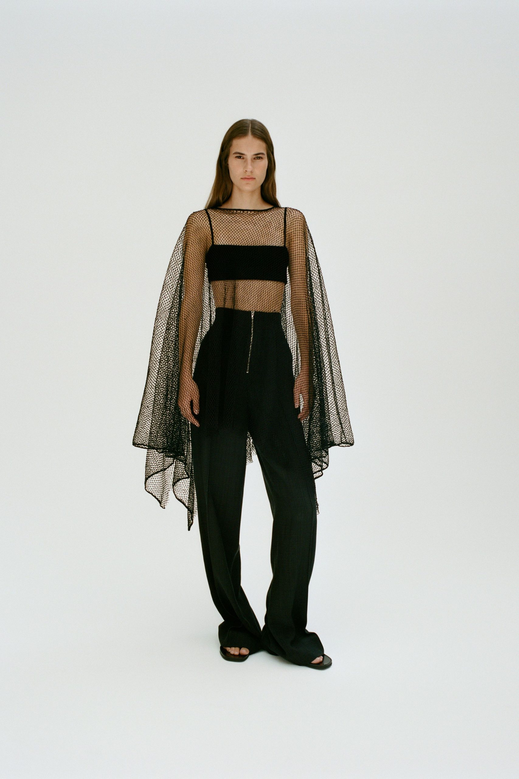 black mesh top and relaxed pants