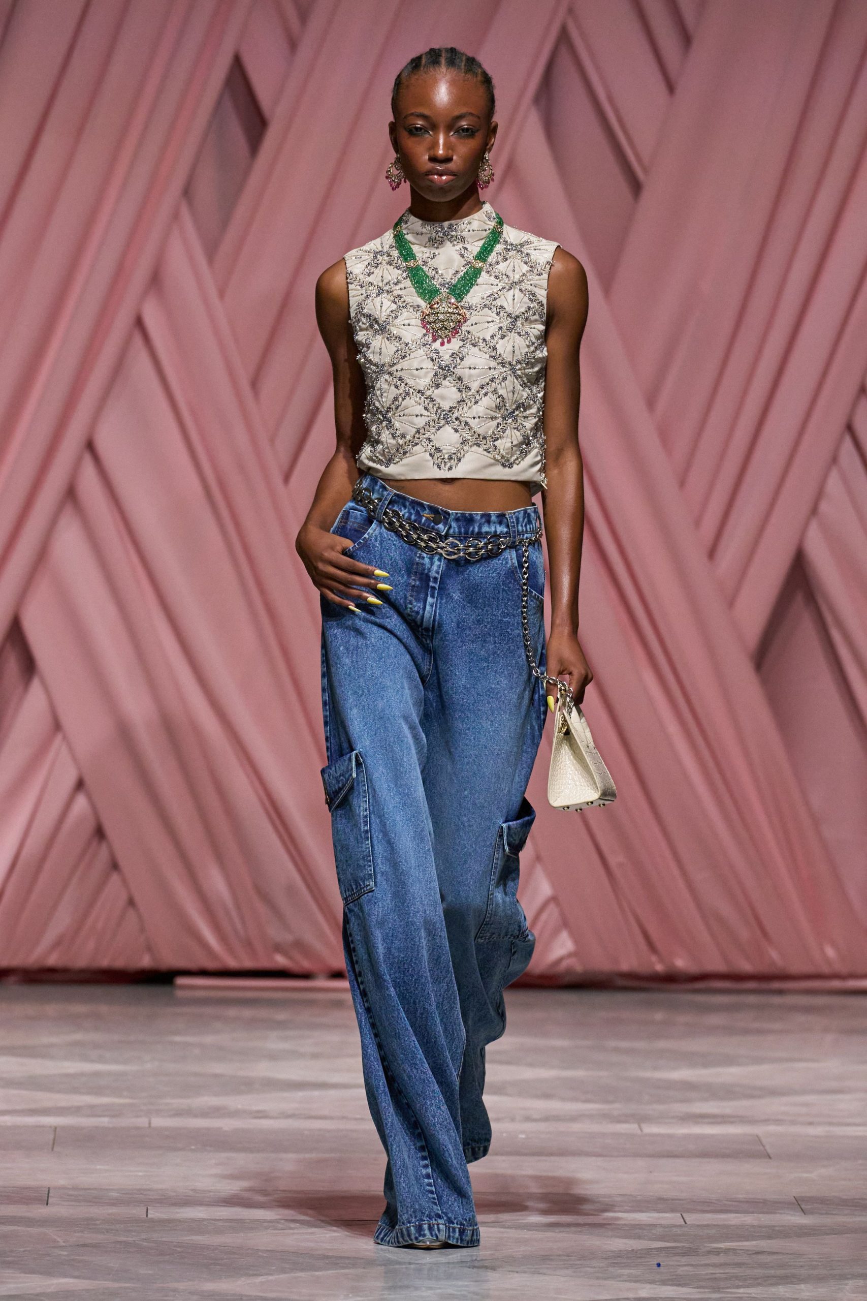 beige lace crop-top with blue denim pants
