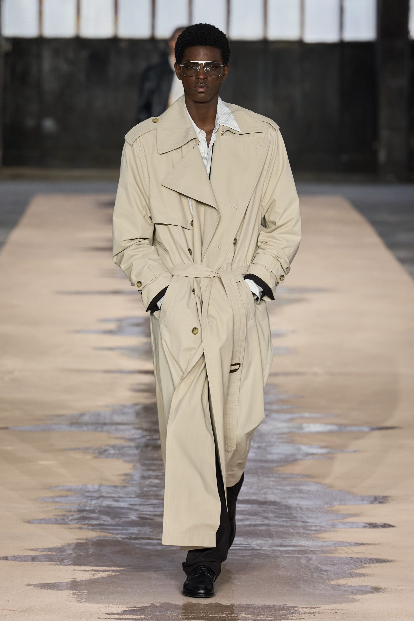 beige trench coat with black pants