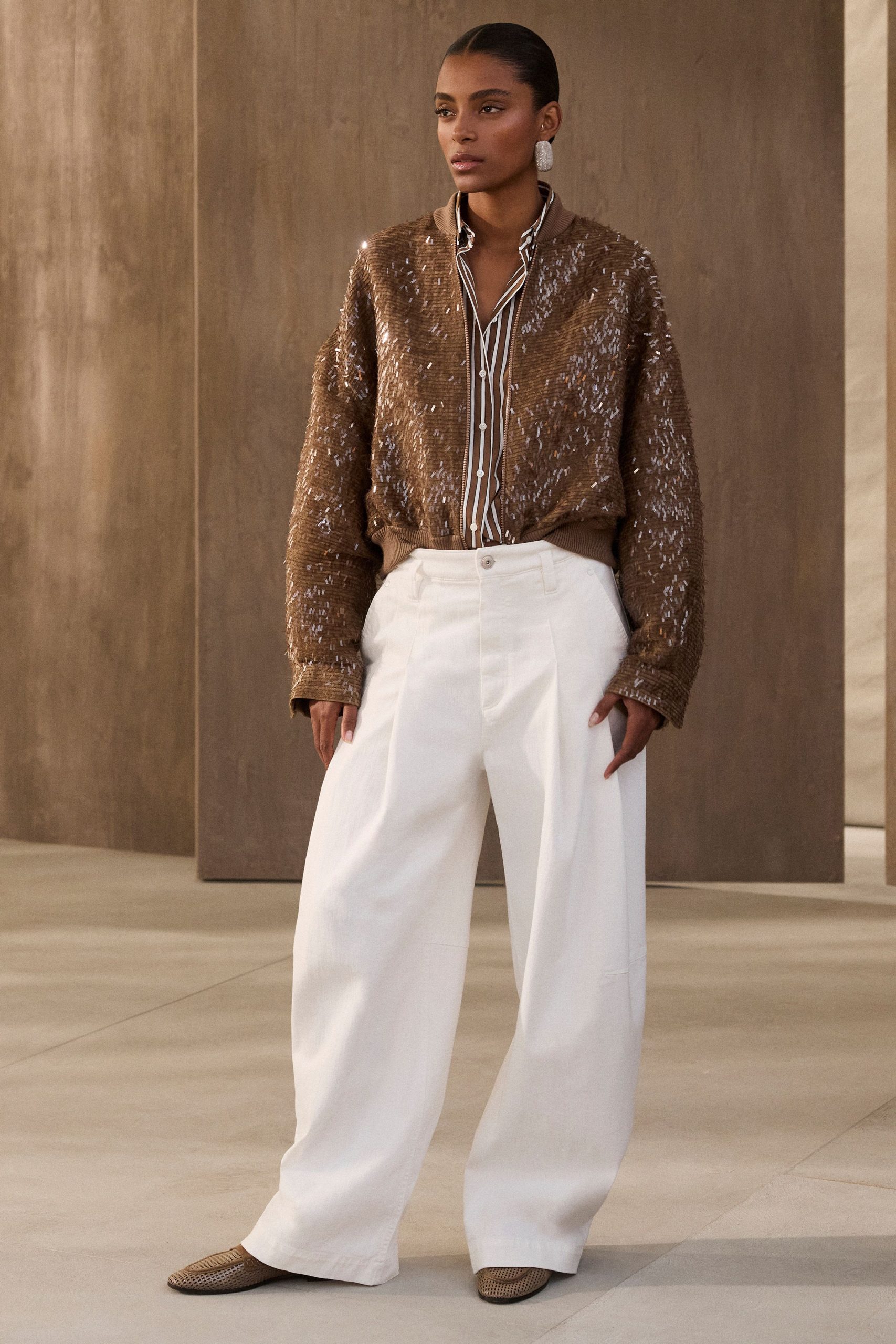 brown oversized sweater with white pants